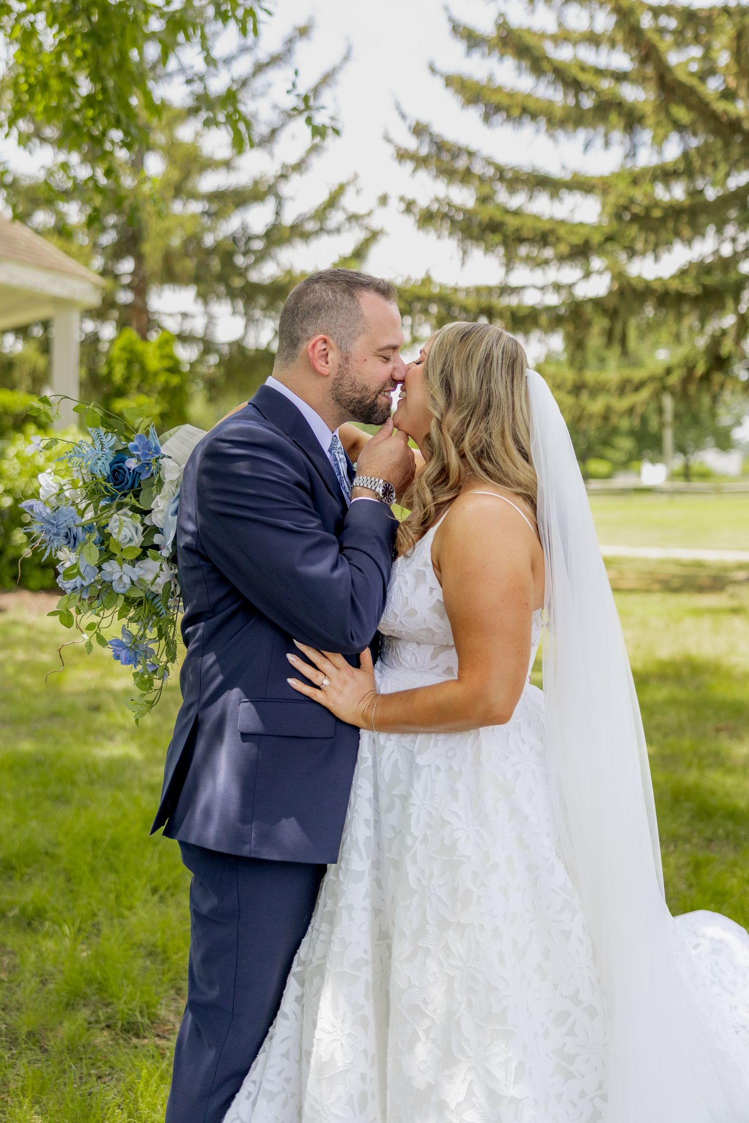 A romantic outdoor wedding photo sequence shows a couple in traditional wedding attire sharing intimate moments beneath evergreen trees.