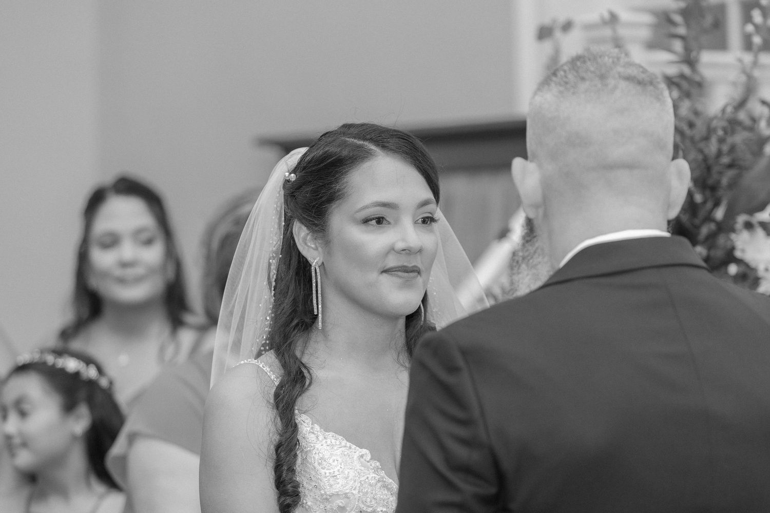 Black and white ceremony photo capturing an emotional wedding moment.