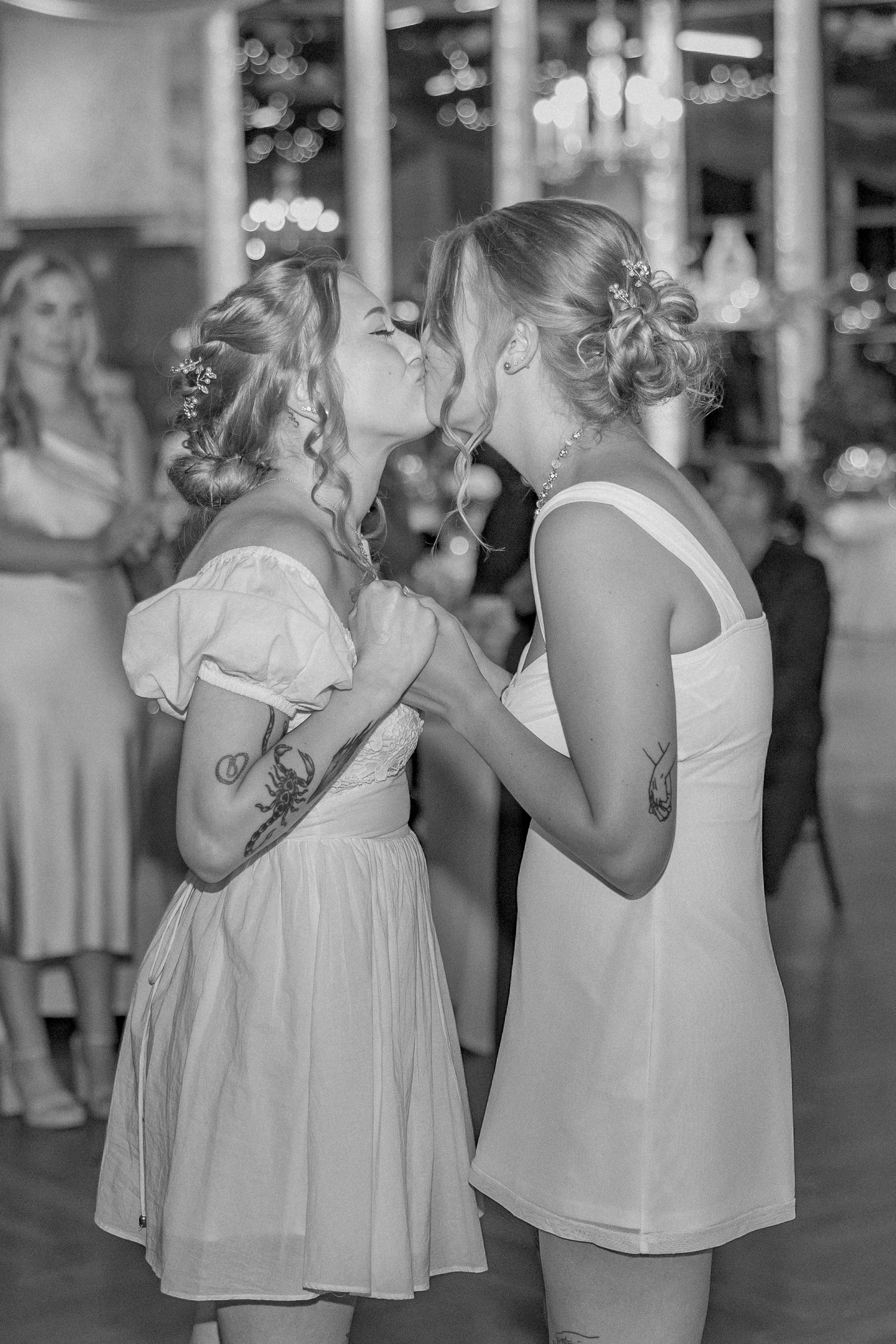 A series of black and white dance photos showing children in white dresses at a wedding reception.