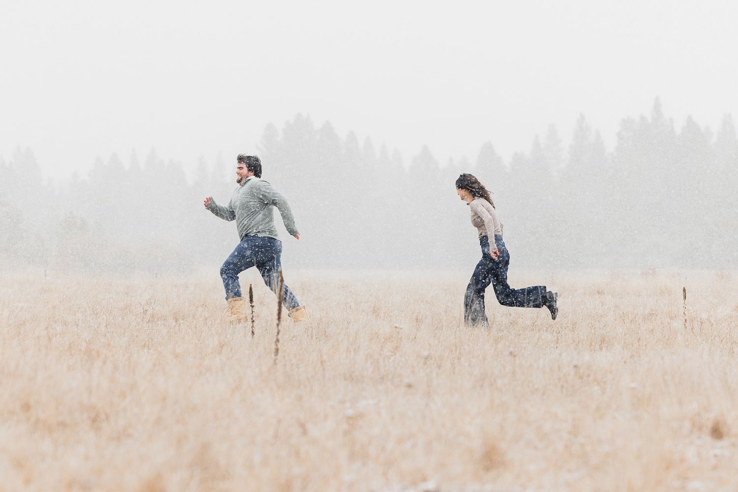 A sequence of people running and jumping in a misty field during a playful outdoor activity.