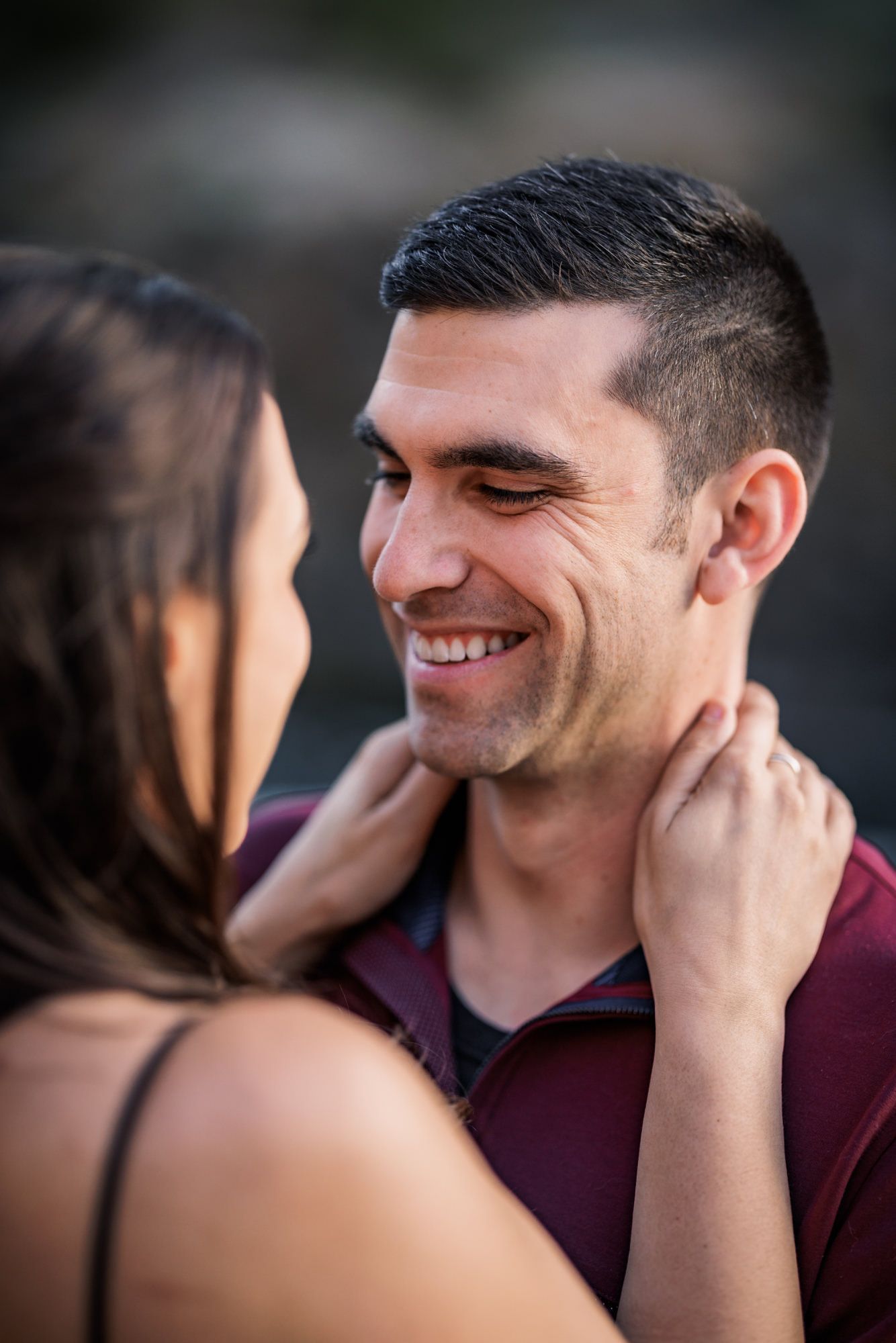 A romantic engagement photo sequence shows a couple sharing tender moments and laughter together.