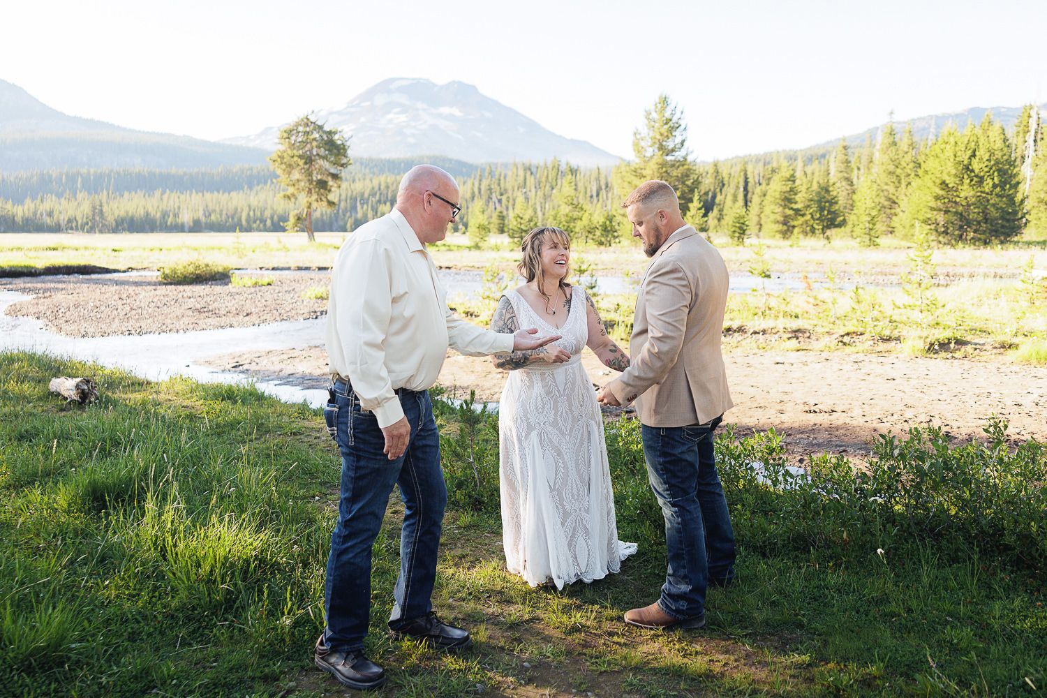 Wedding ceremony candid shots capture intimate moments between a couple in a scenic mountain setting.