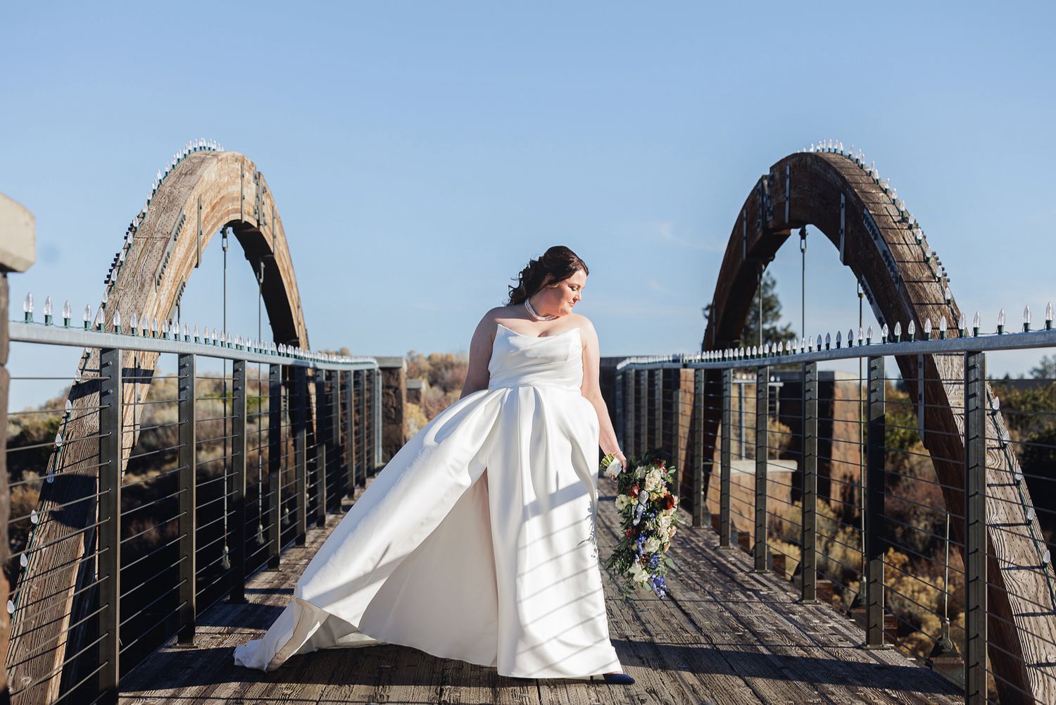 A series of wedding photos captured on a rustic wooden bridge with flowing white dress details.