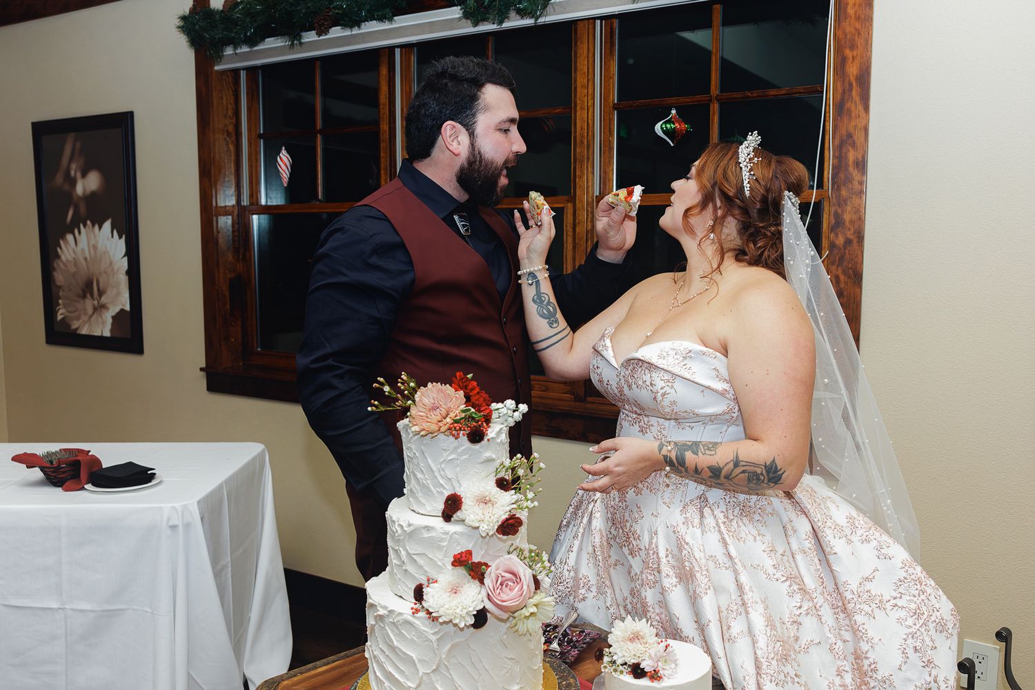 A wedding reception celebration with couples dancing together on a wooden dance floor.