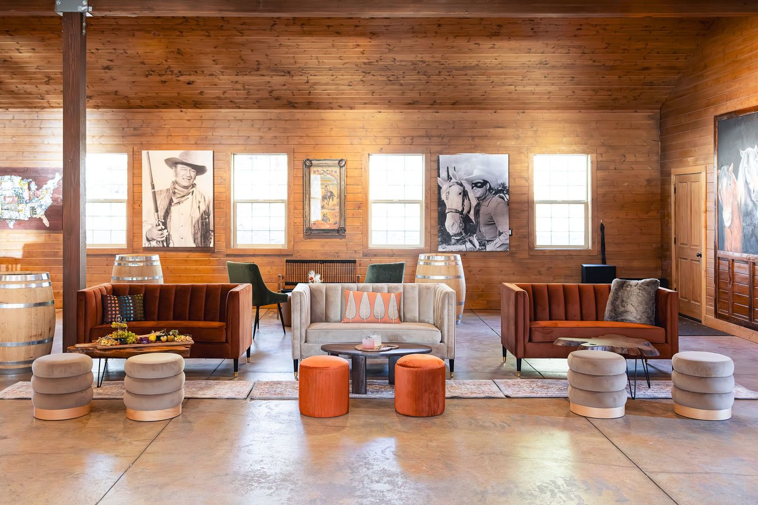 Rustic lounge area with wooden walls, vintage furniture and decorative lighting.