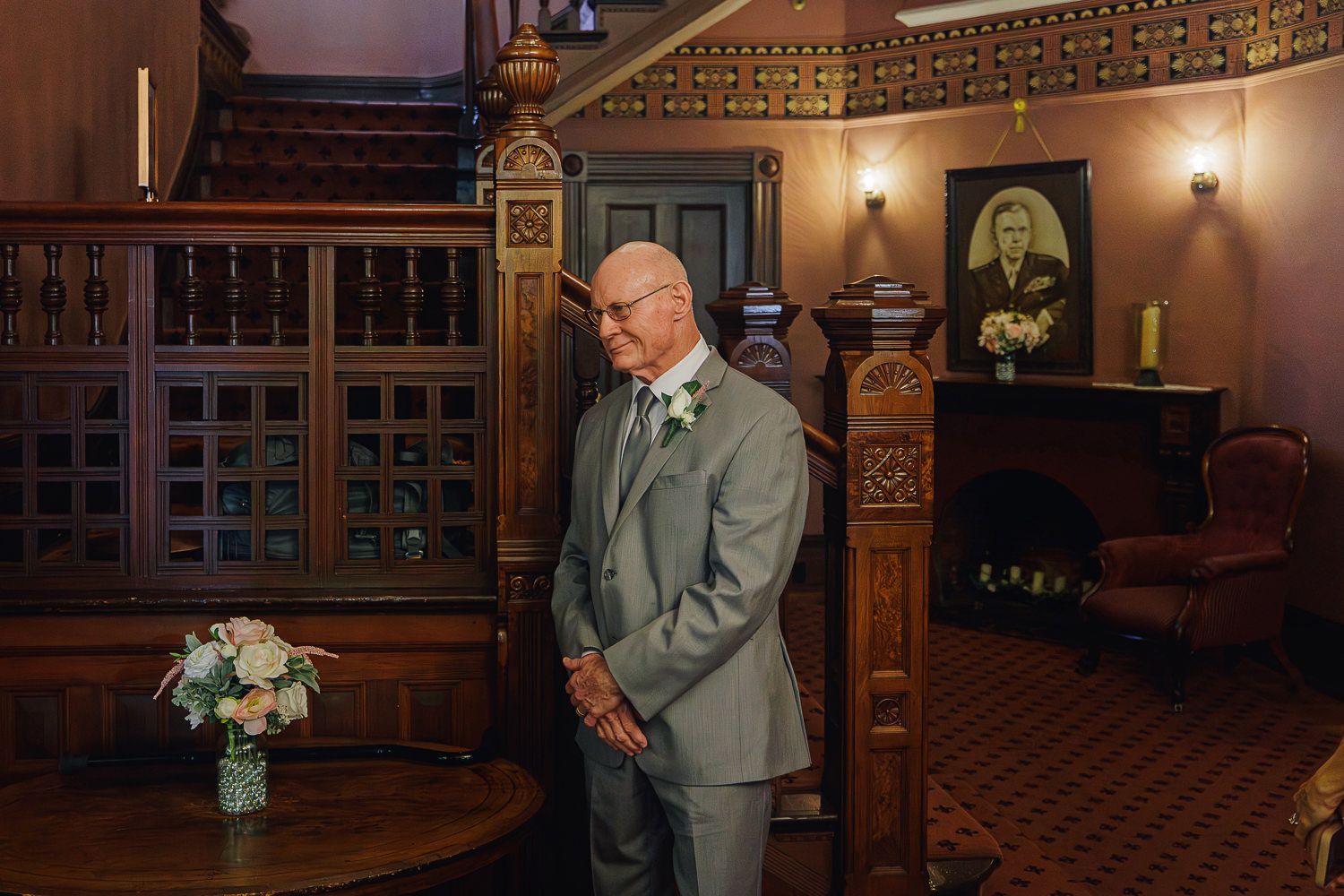 Elegant wedding portraits captured in a historic wooden-paneled venue with warm lighting and ornate architectural details.