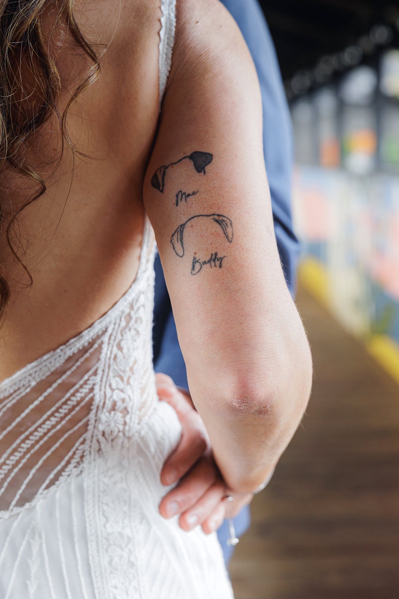 Small umbrella tattoo design shown on person's arm with delicate linework details.