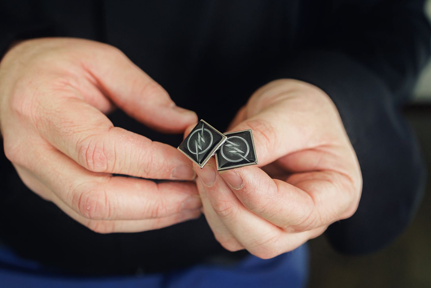 A close-up sequence showing hands assembling small electronic components or circuit board parts.