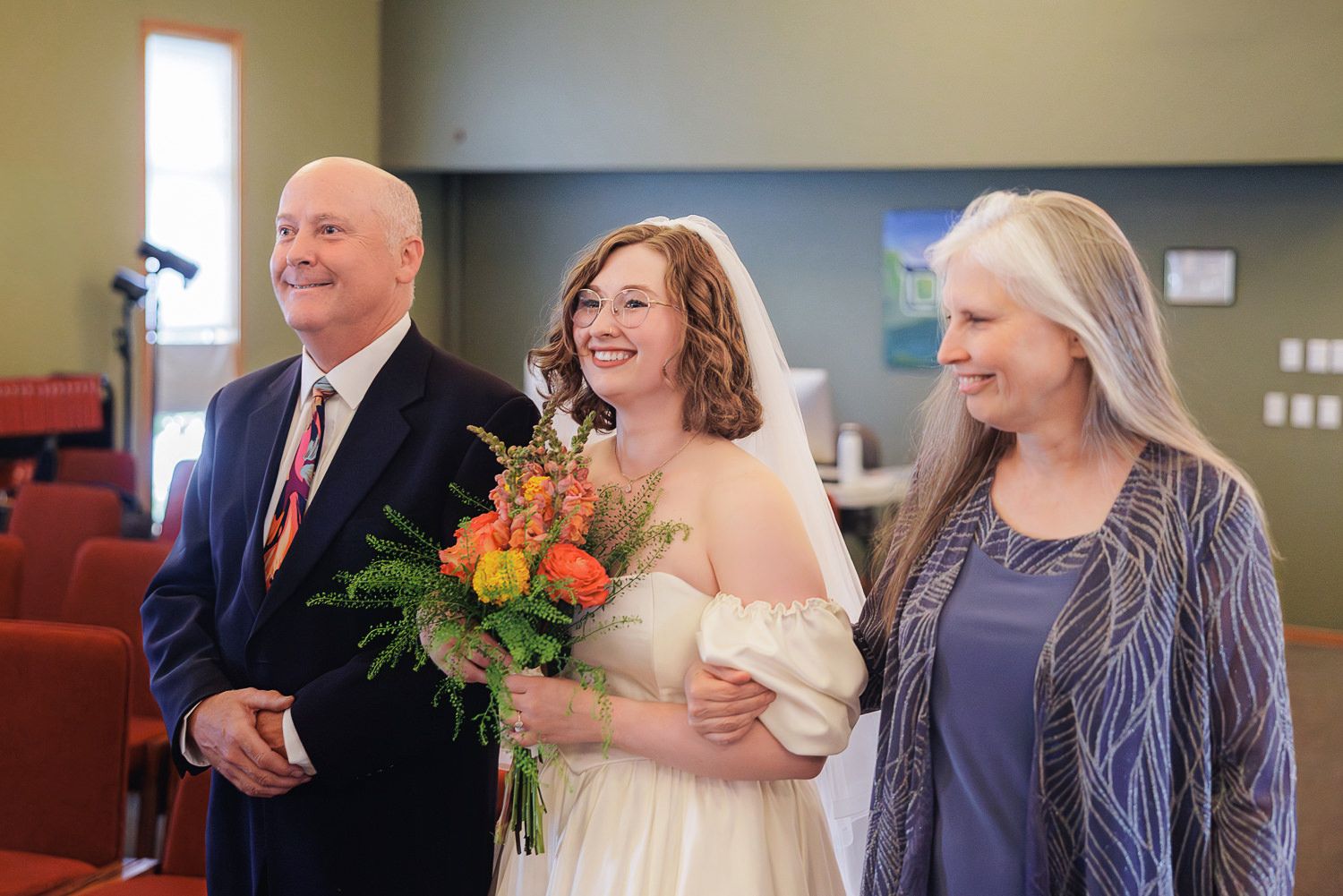 A collection of candid wedding moments showing joyful interactions between guests and the wedding party at an indoor venue.