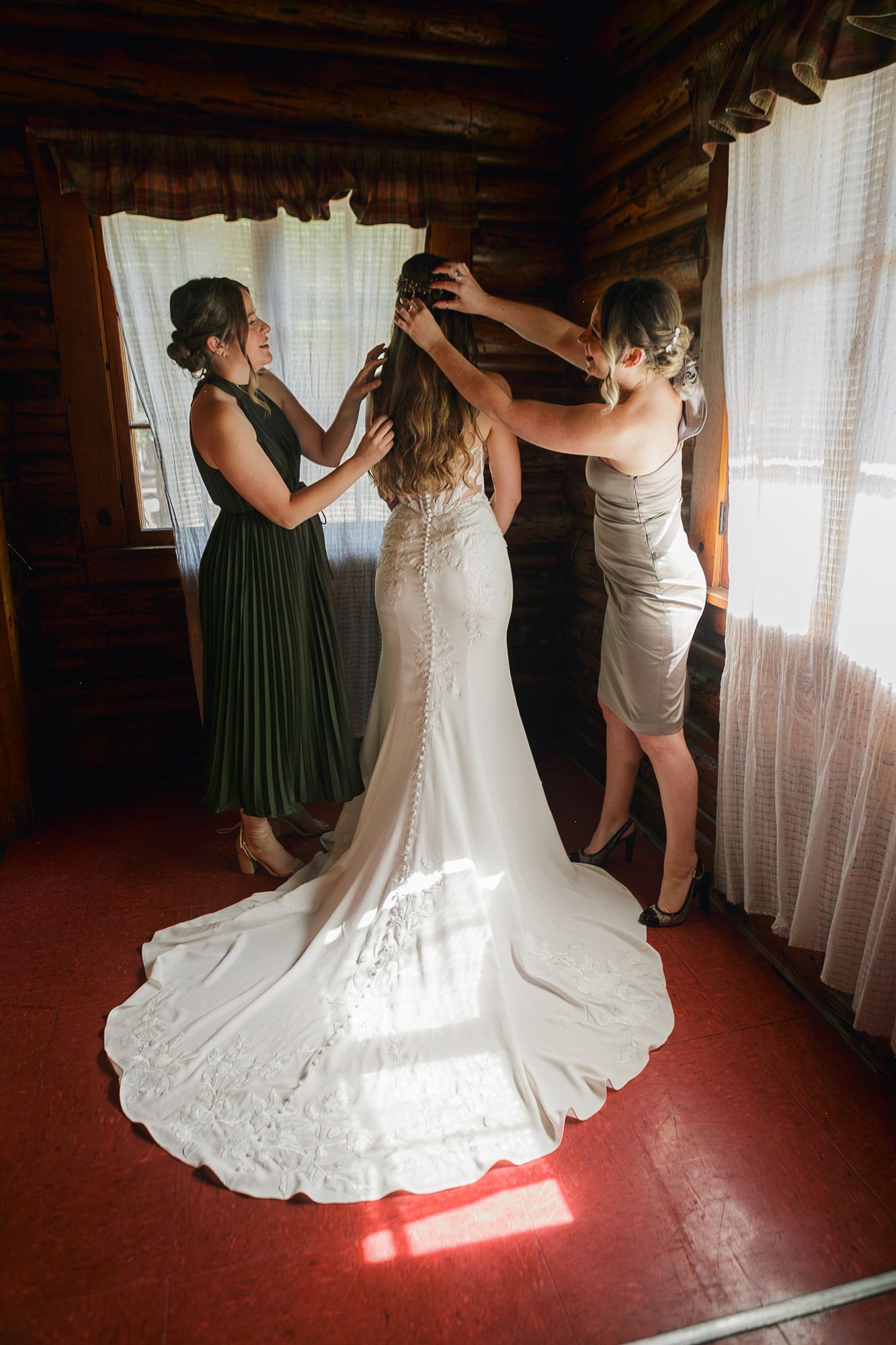 Wedding dress preparation sequence showing the intricate details of a flowing white gown against a rustic wooden backdrop.