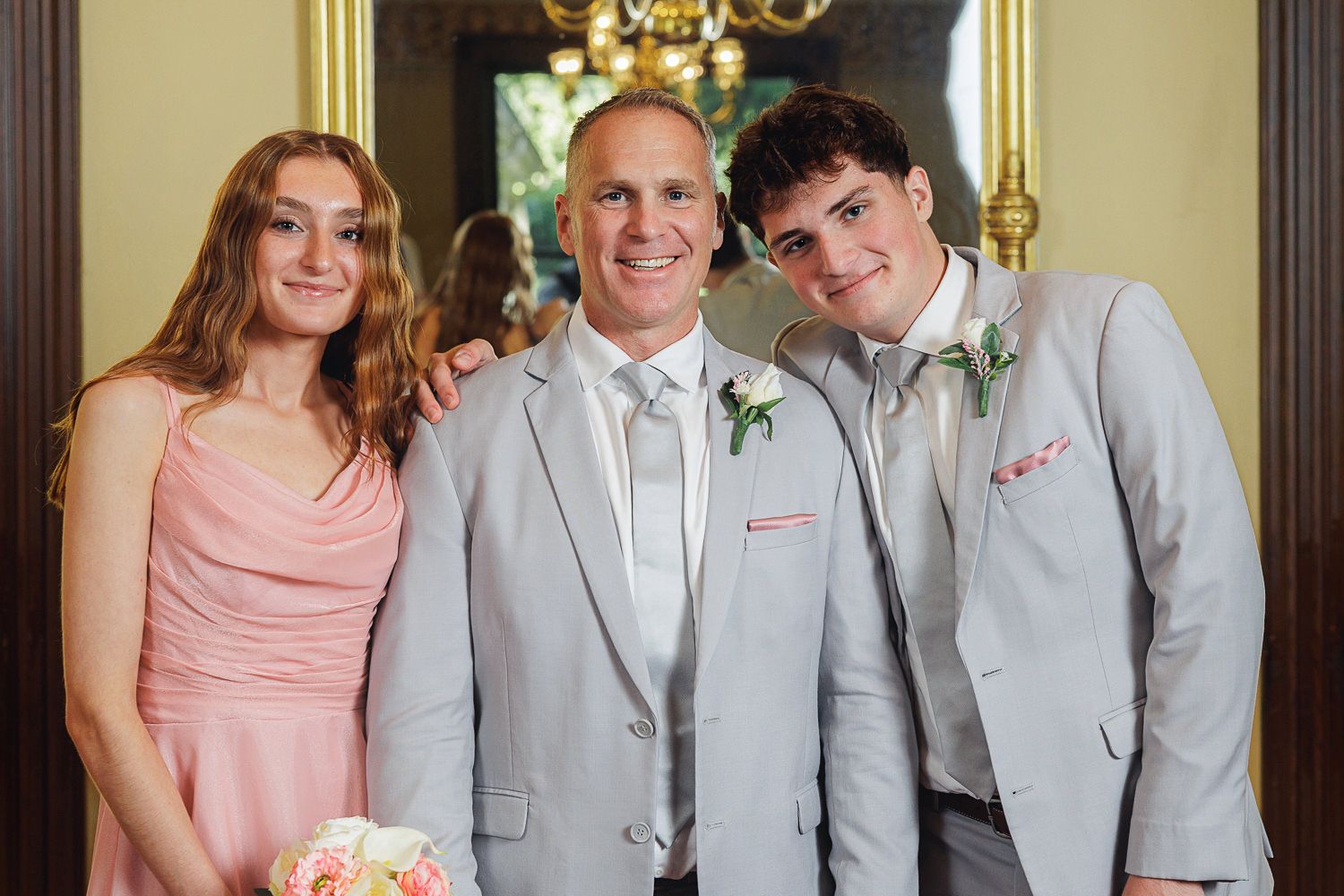 A series of wedding party photos showing bridesmaids in peach dresses posing with groomsmen in gray suits.