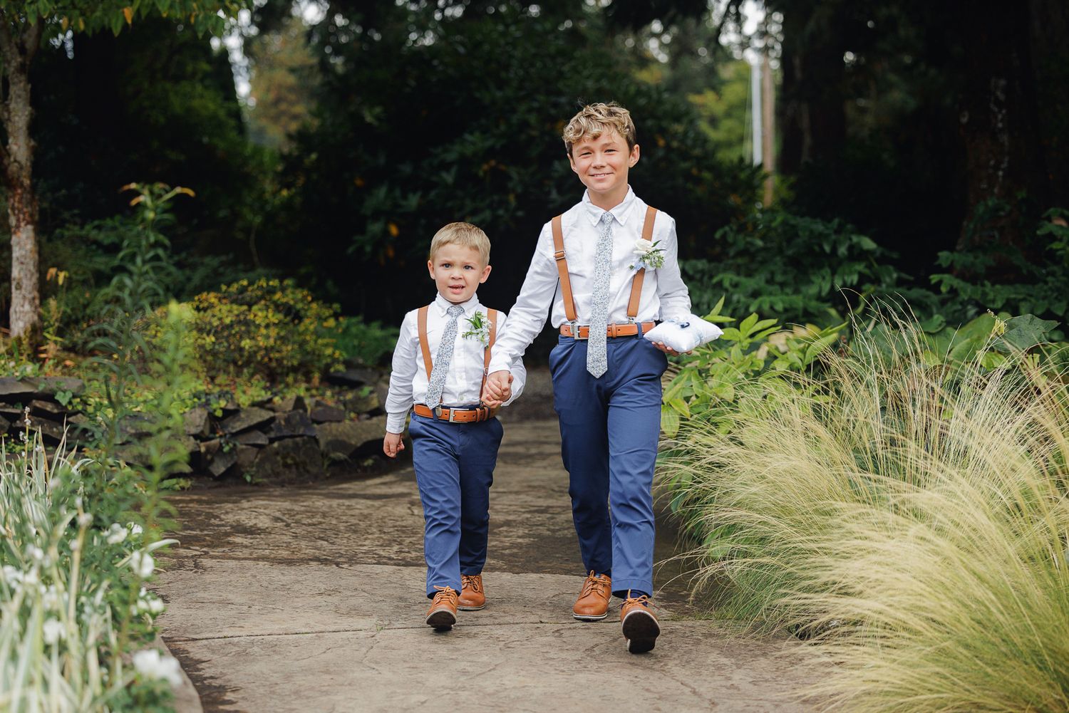 A series of candid outdoor family photos taken on a garden path with ornamental grasses and natural landscaping.