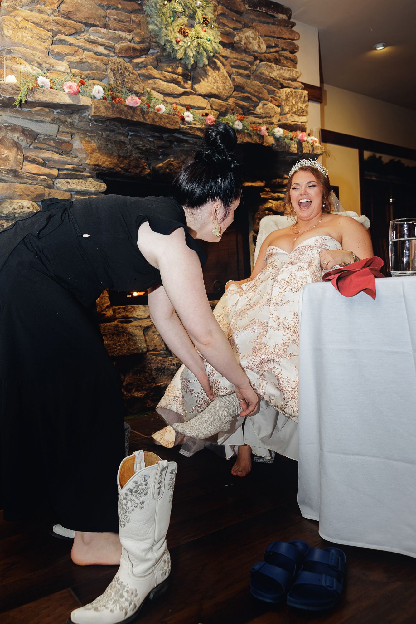 A sequence of playful dance moves captured at a wedding reception against a rustic stone wall backdrop.
