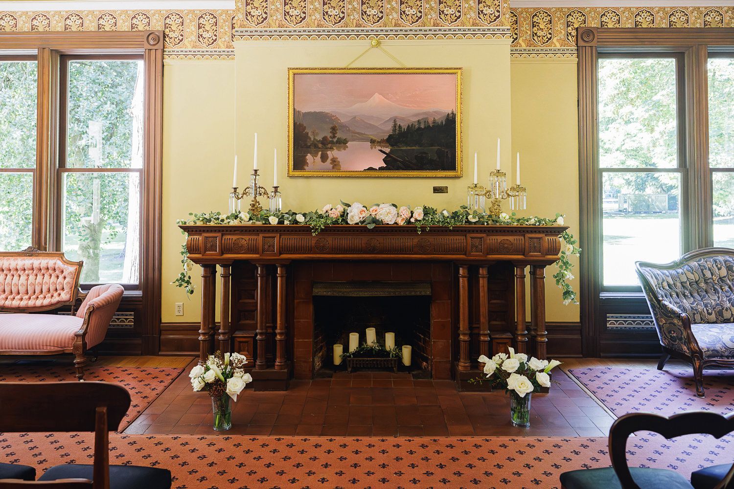 Elegant interior panorama of a grand room with ornate moldings, classic furniture, and natural light streaming through windows.