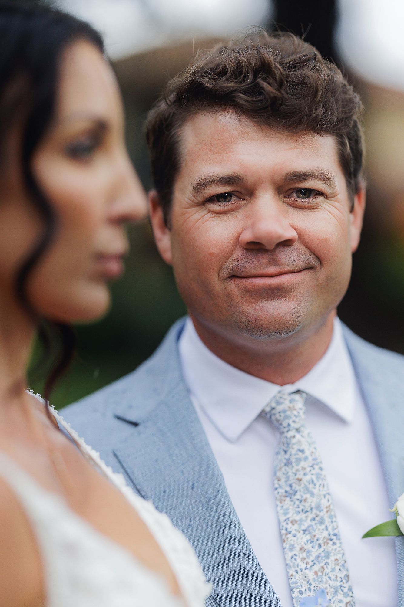 Close-up portrait sequence showing expressions of joy and laughter during an outdoor wedding celebration.