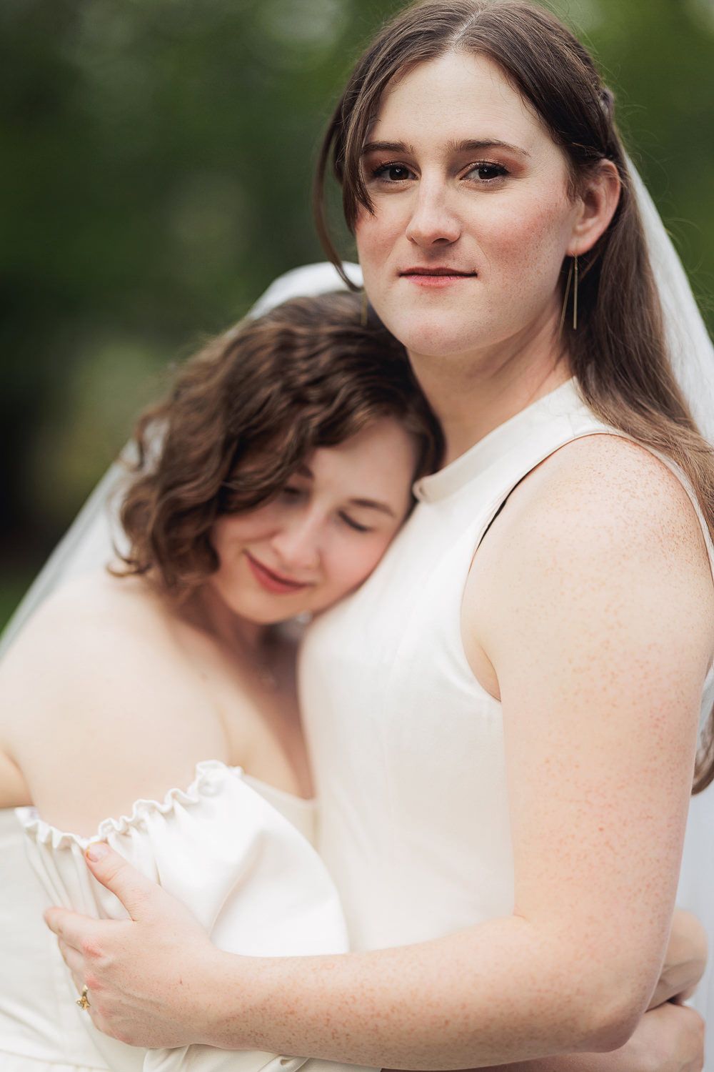 A series of intimate wedding photos showing tender embraces and white dresses in an outdoor setting.