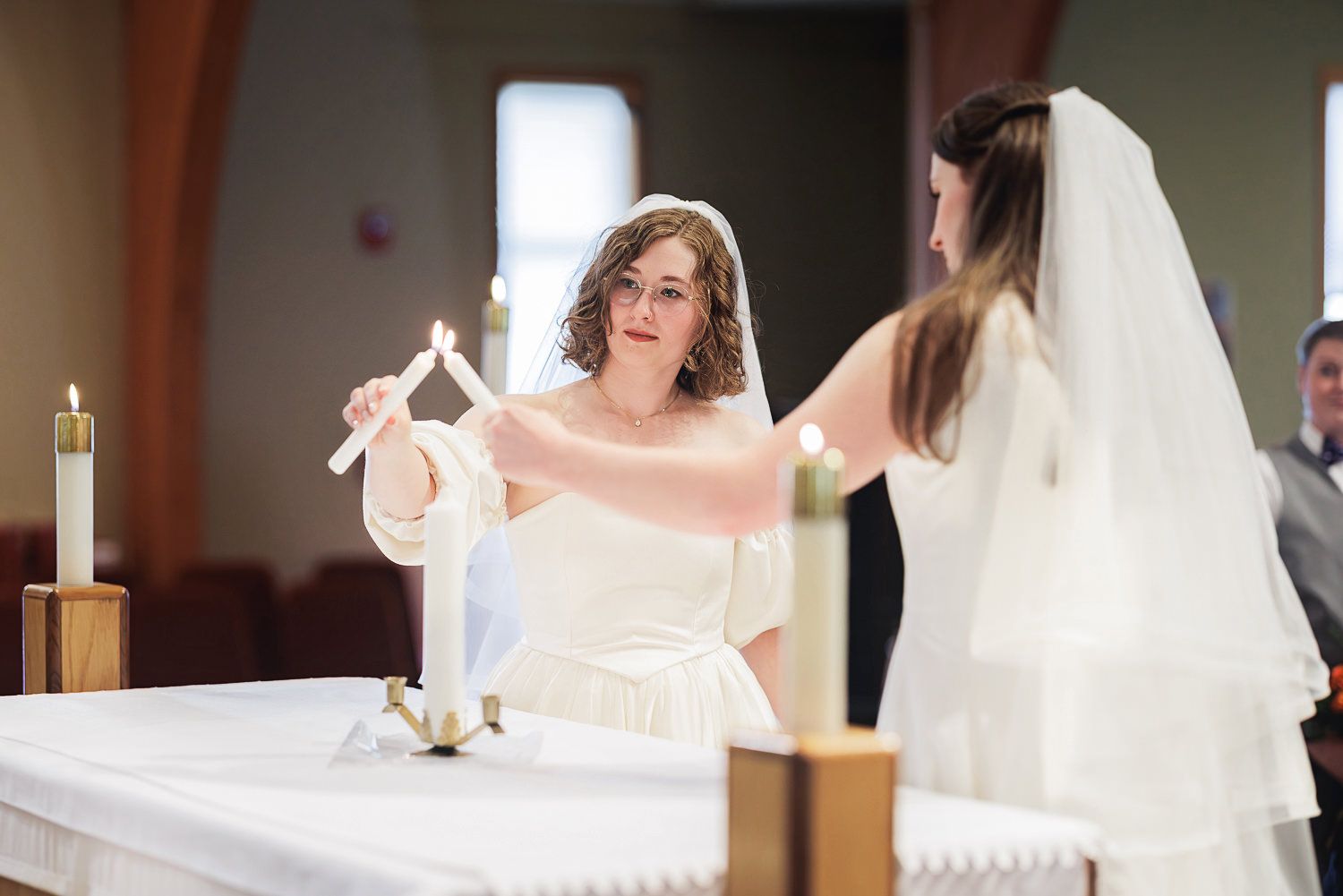A series of wedding preparation photos showing white dress details and veil adjustments in soft indoor lighting.