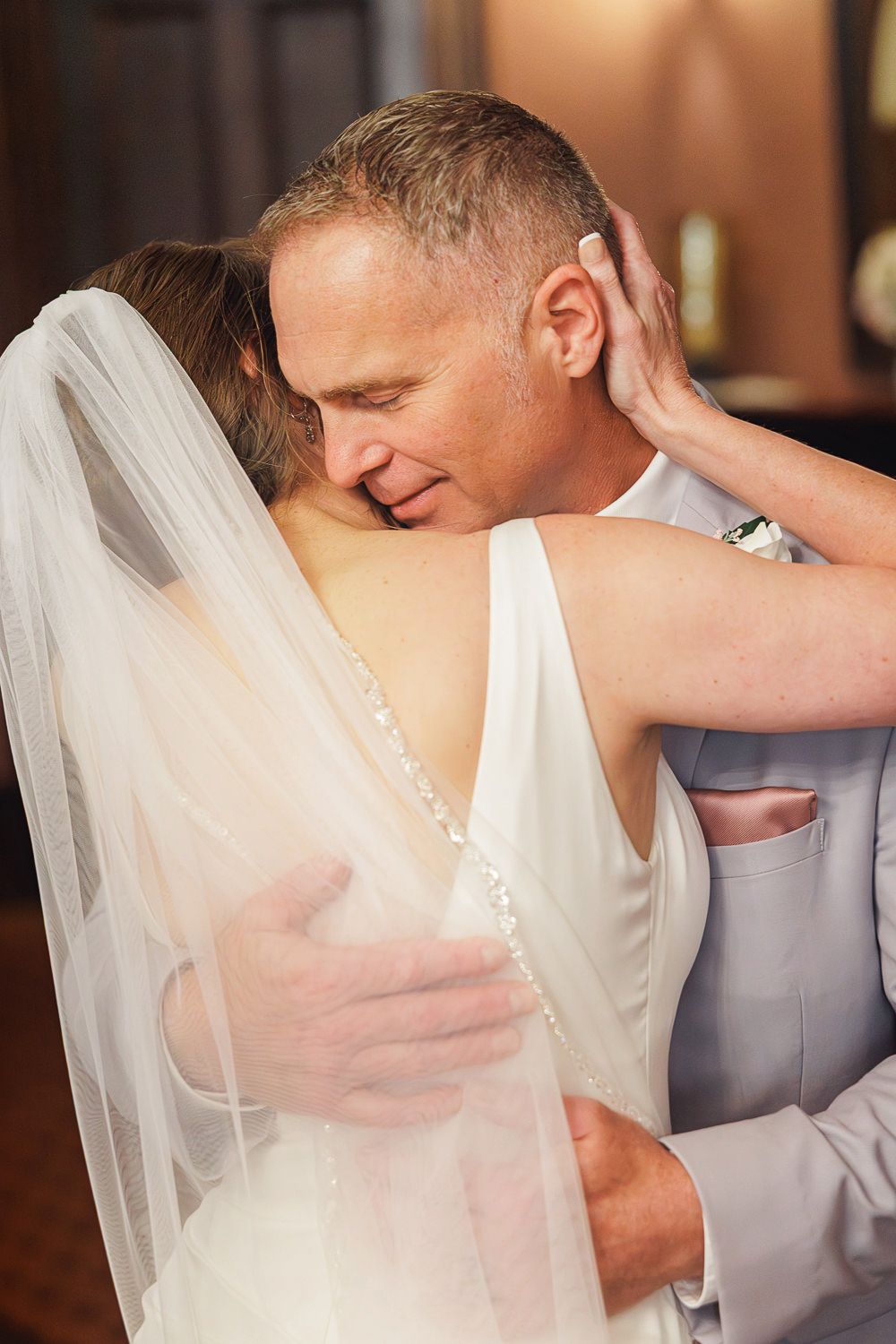 A romantic wedding sequence shows a tender first kiss between the newlyweds in a series of elegant photographs.