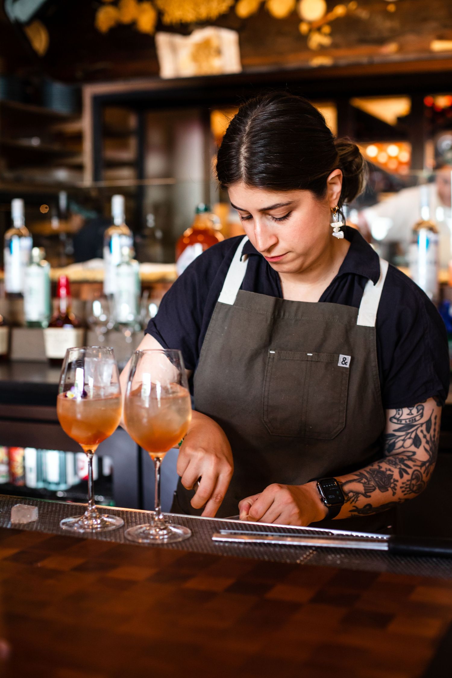 Denver food photographer and Denver social media manager, bartender making drinks