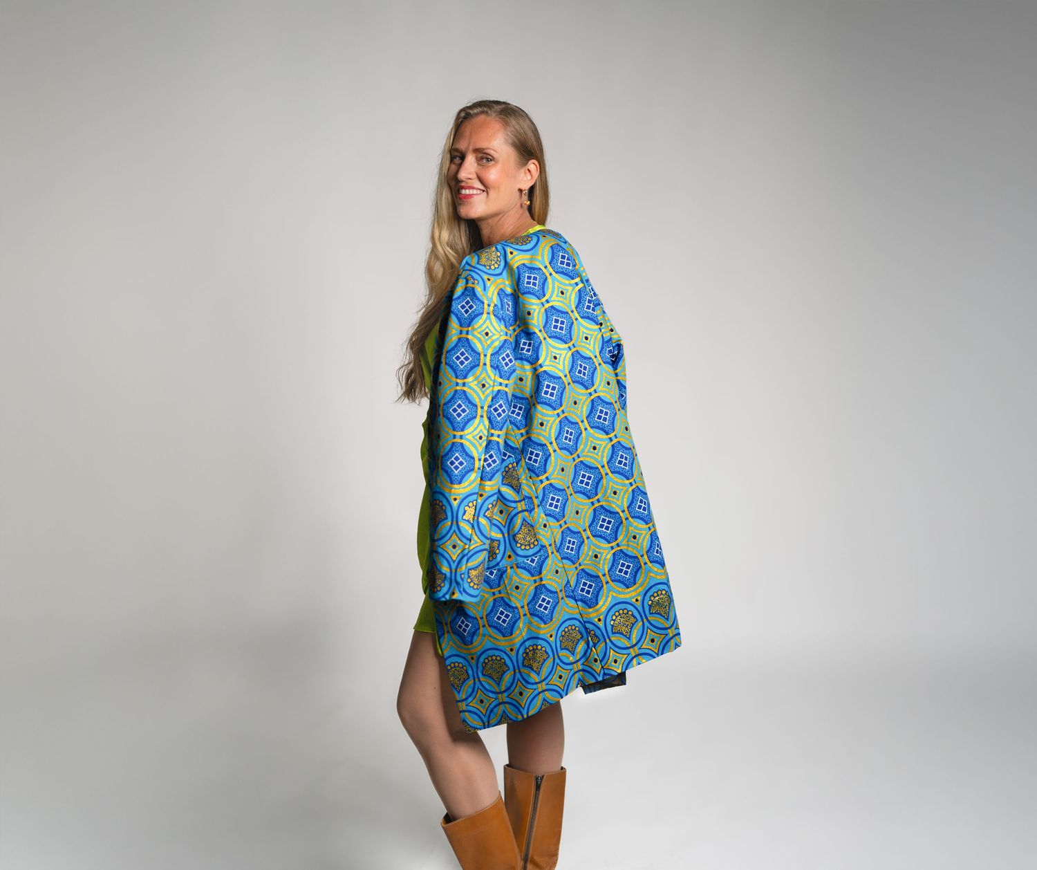 A blue and yellow peacock patterned reusable shopping bag shown from multiple angles against a white background.