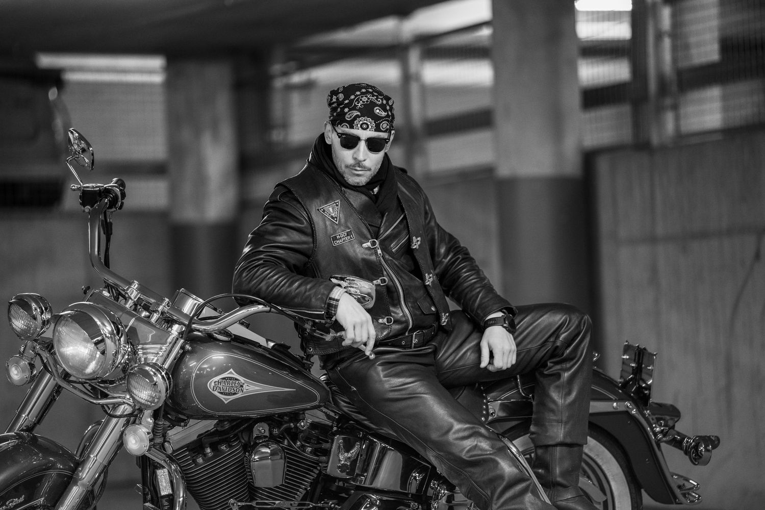A collection of black and white motorcycle images arranged in a horizontal strip showing different angles and details.