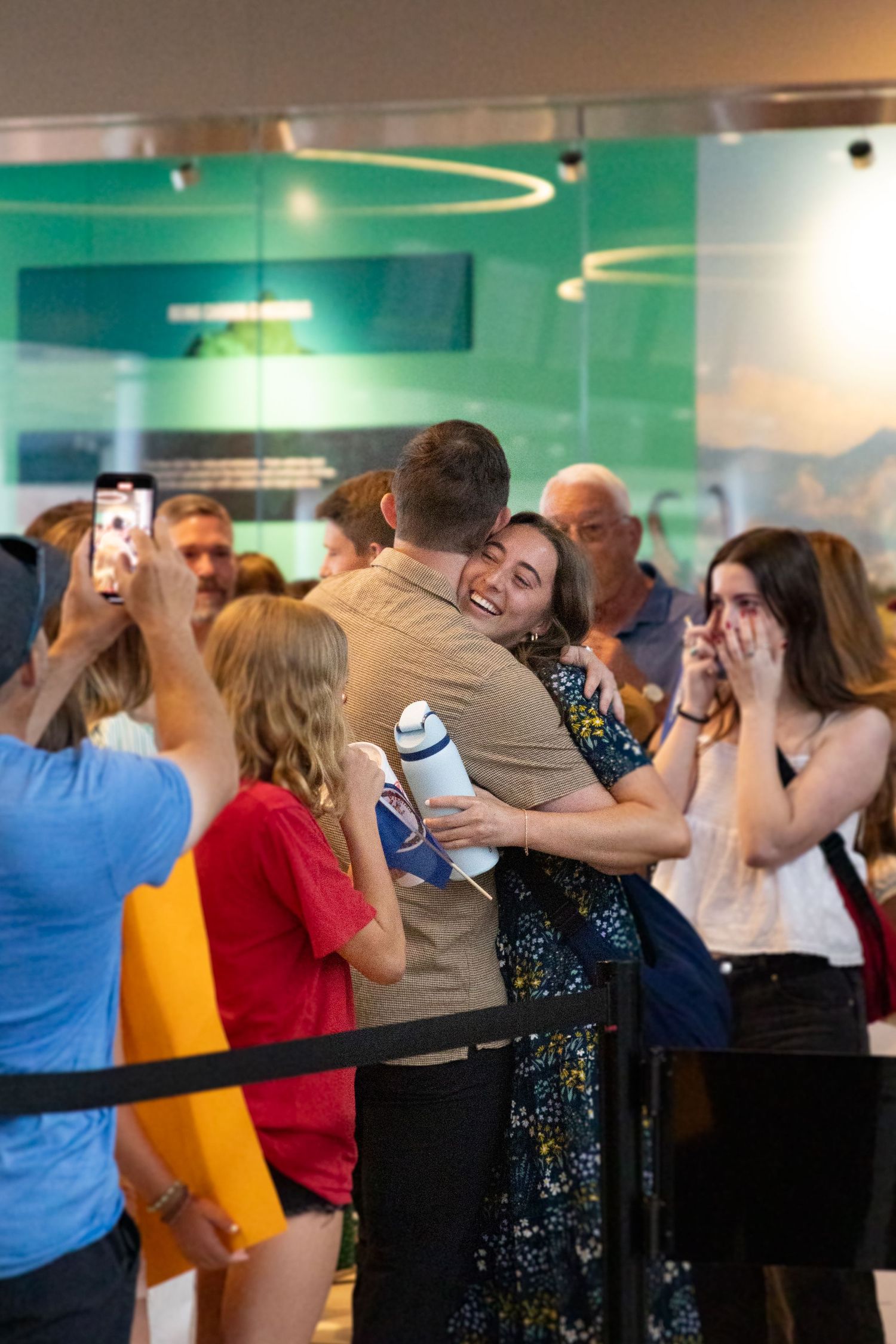 Siblings reunite with their return missionary sister in the Salt Lake Airport.