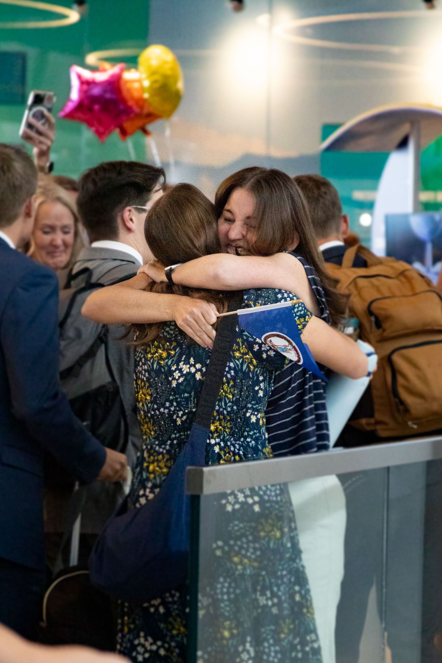 Returned missionary embraces her mom in the Salt Lake City airport.