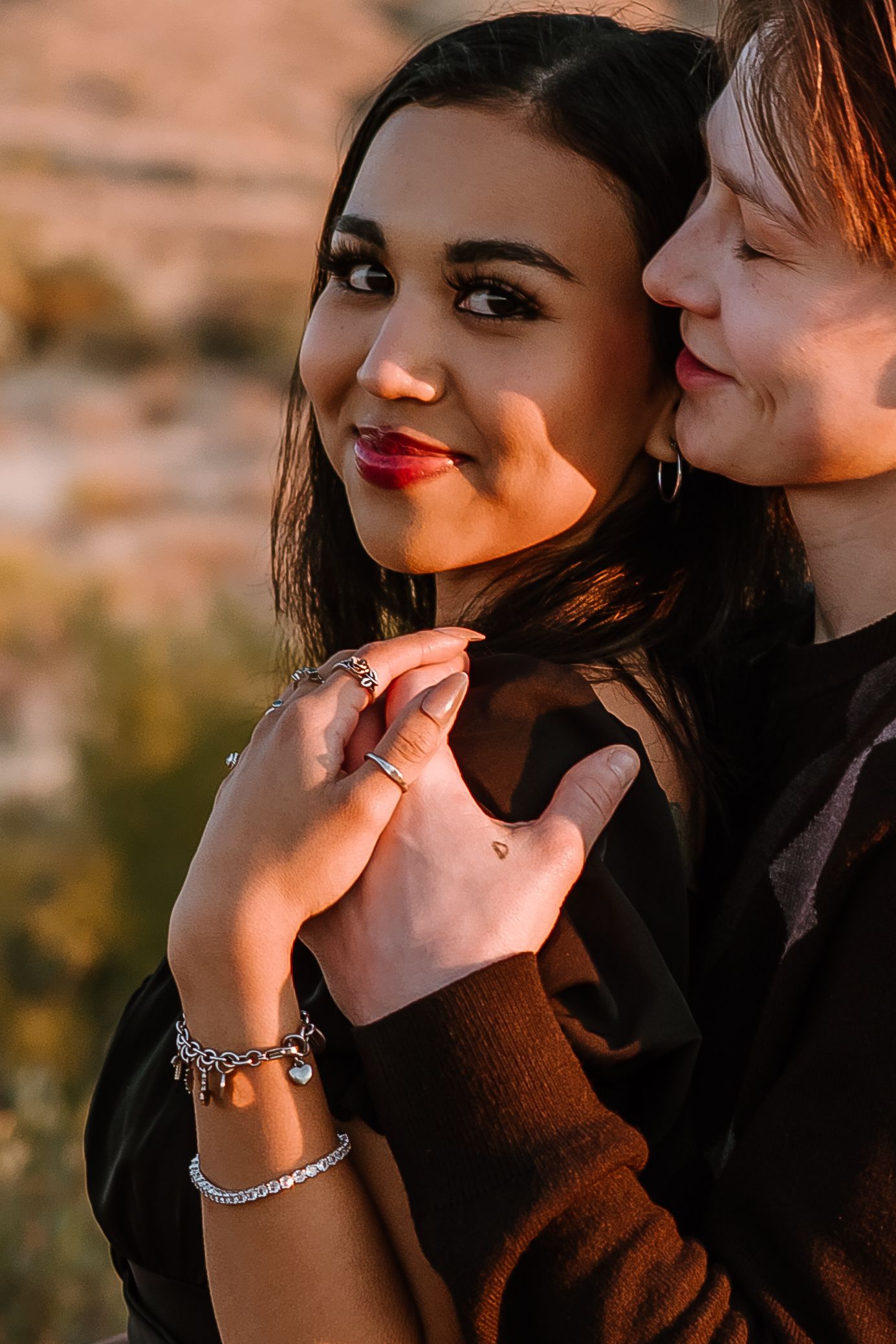 Intimate close-up shots showing affectionate moments in golden desert light.
