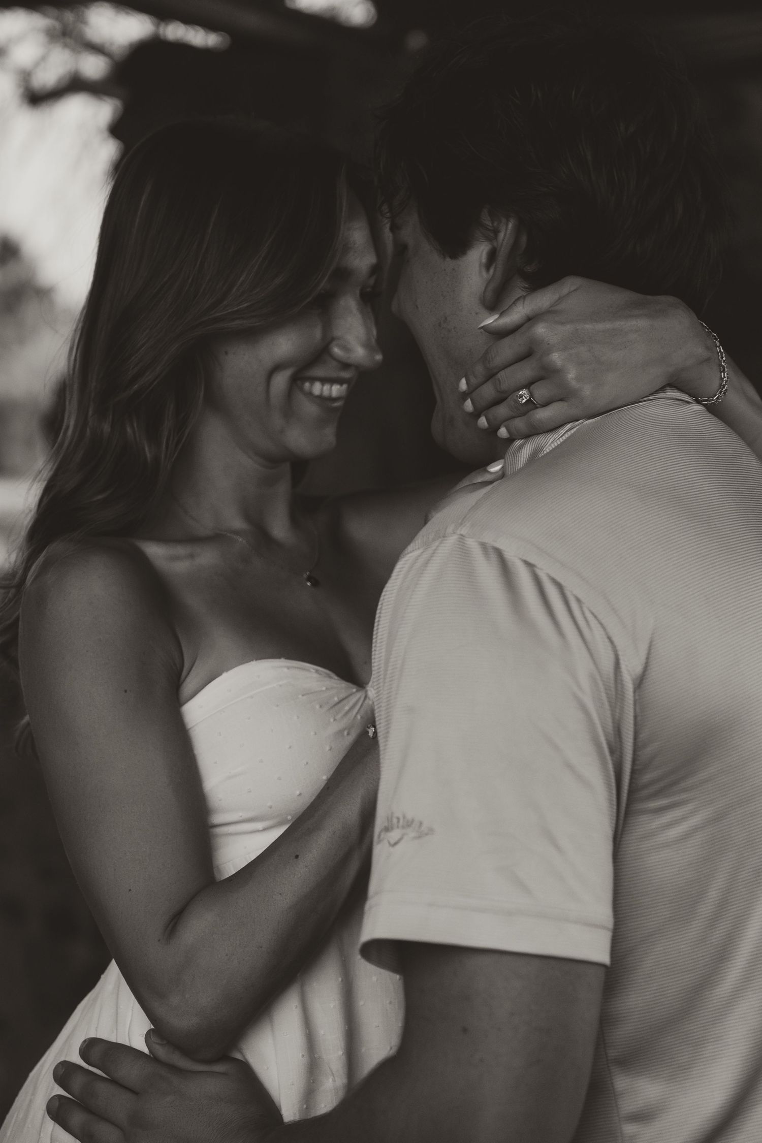 Intimate black and white photo sequence showing a couple in a tender embrace.