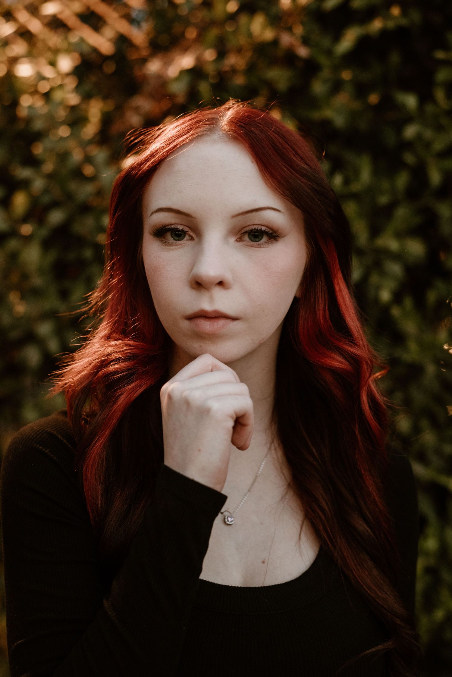 Dramatic portrait with bokeh background and moody lighting.