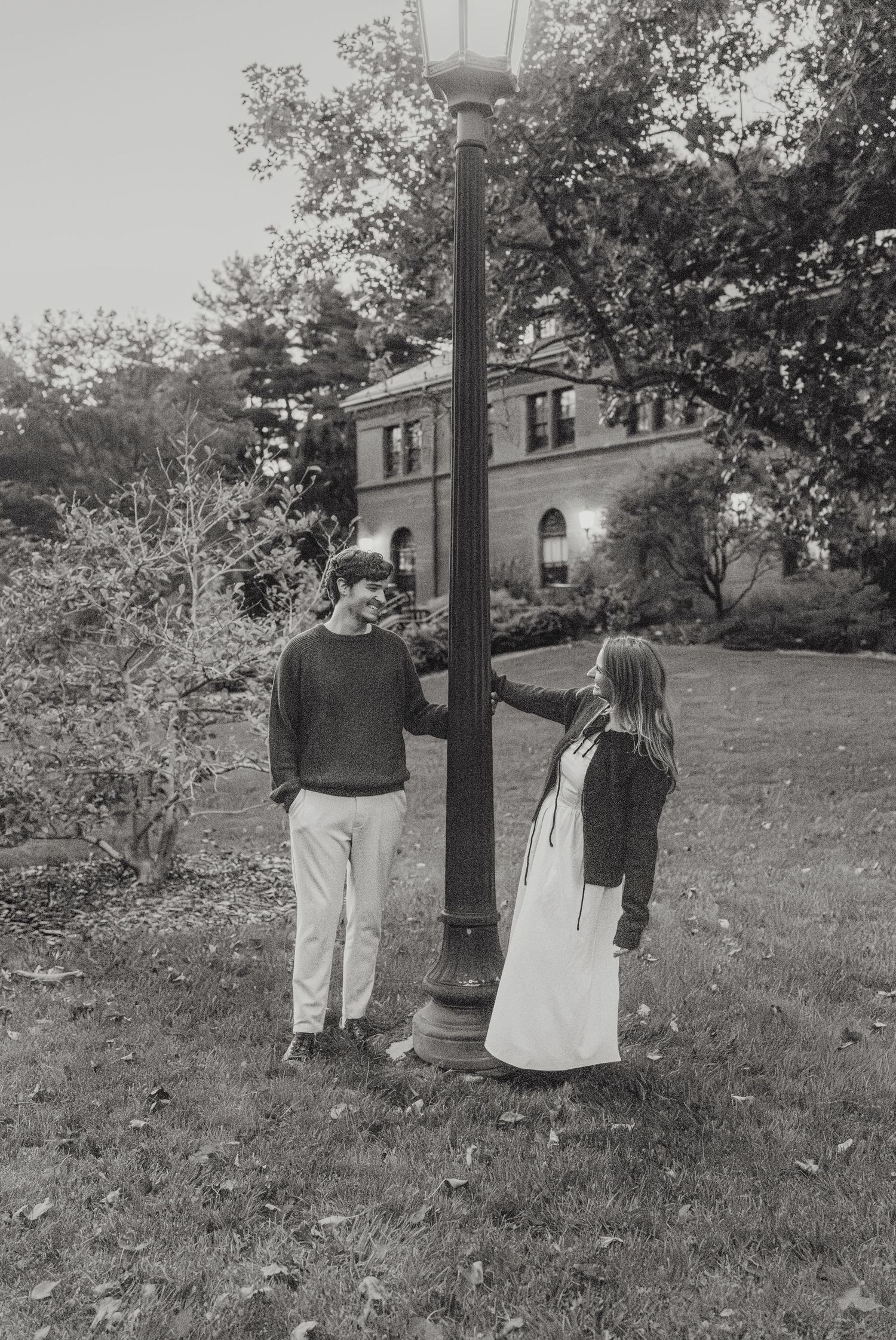 An engaged couple takes vintage black and white style engagement photos at Arnold Arboretum in Boston, Massachusetts