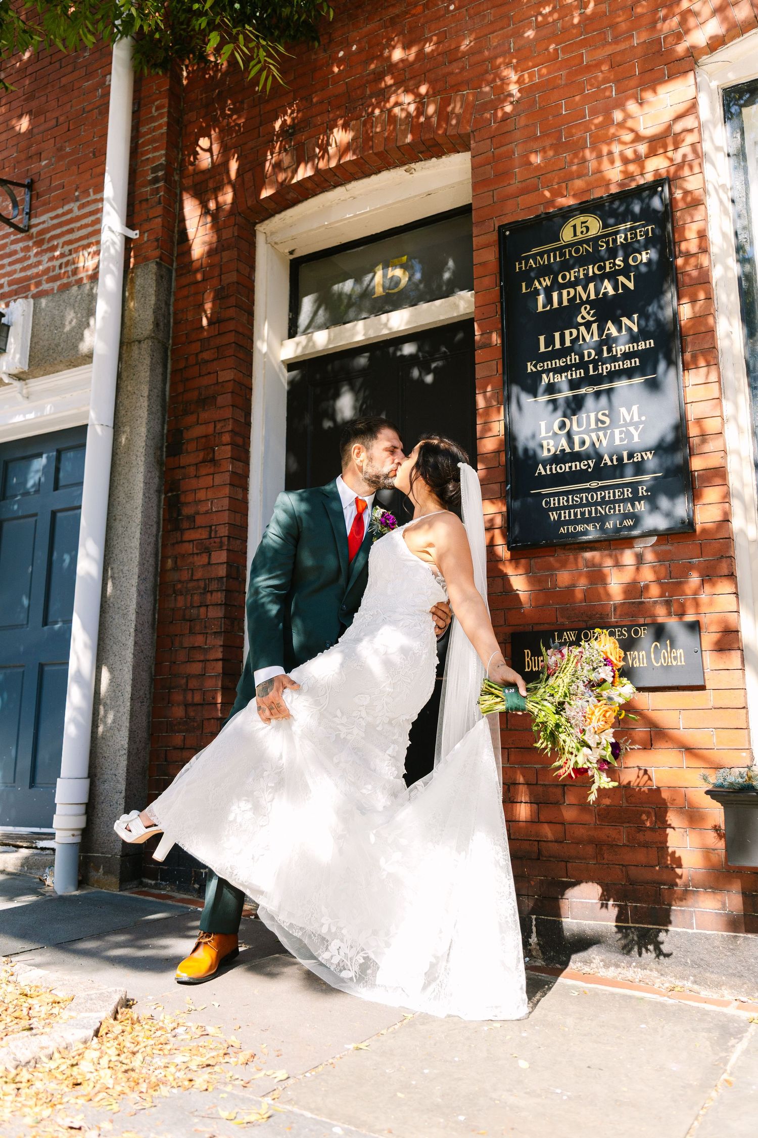 Bride and Groom kiss for city portraits in Downtown New Bedford Massachusetts