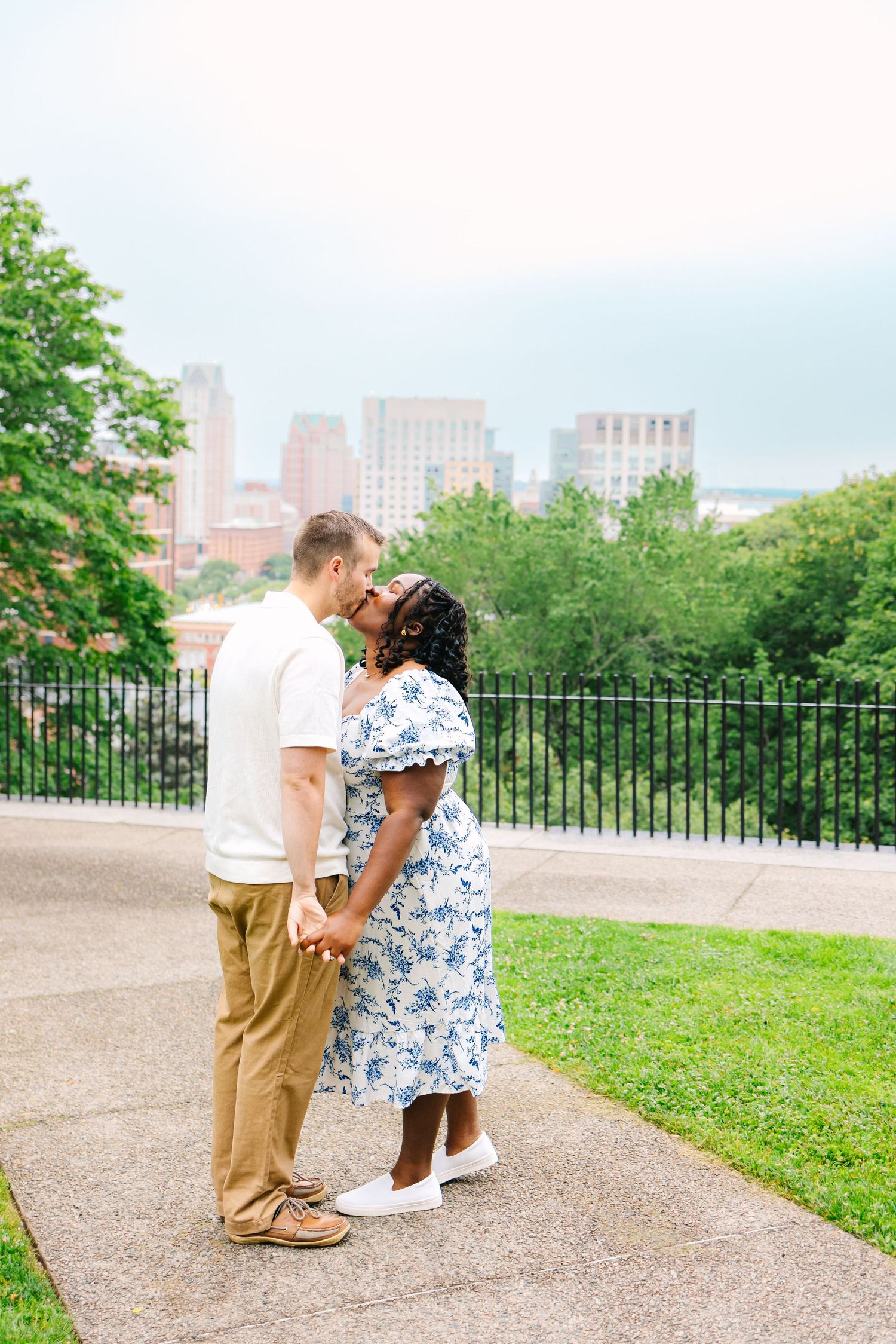 A newly engaged couples takes romantic engagement portraits in Providence, Rhode Island
