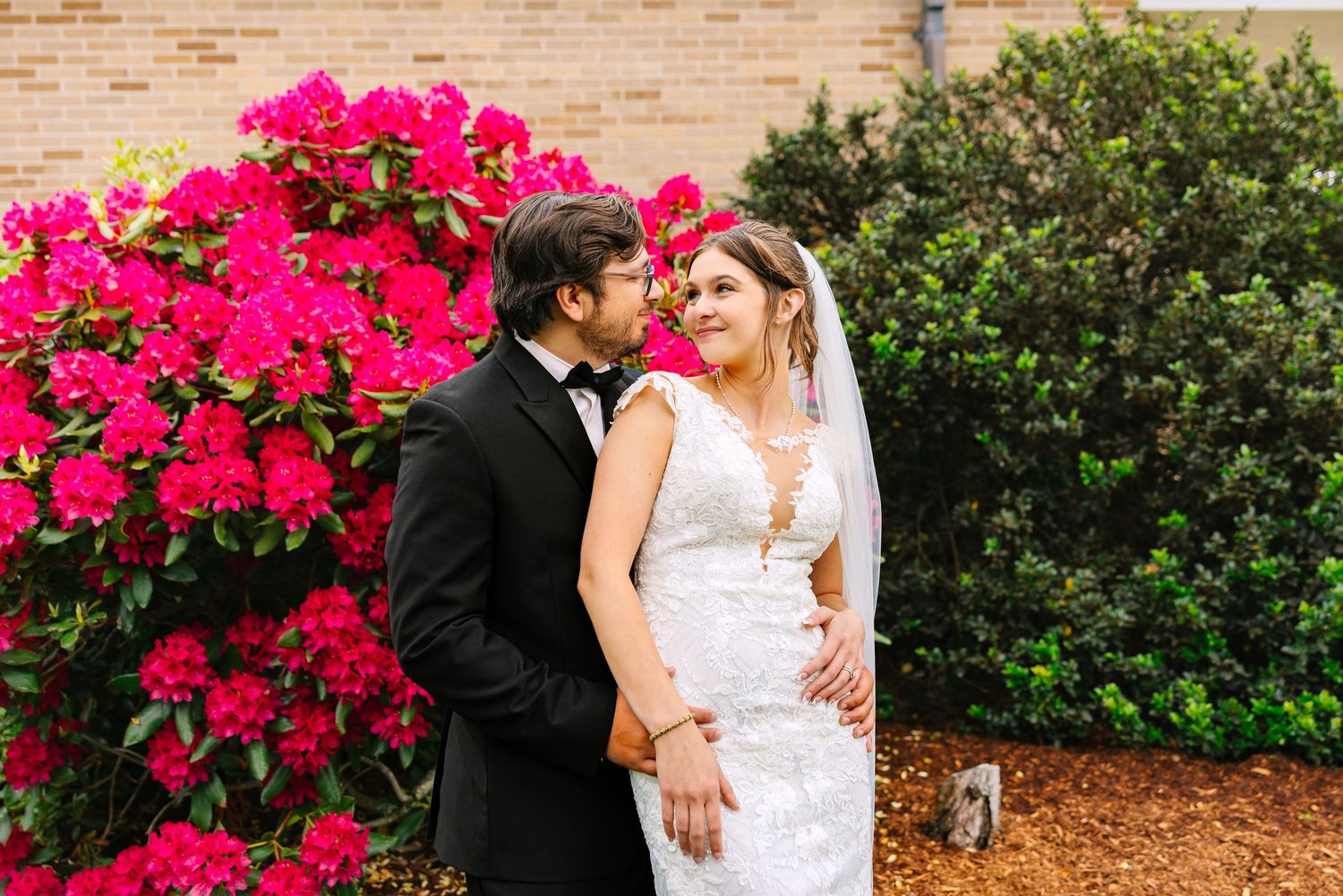 A bride and groom pose for romantic couples portraits at wedding venue in Boston, Massachusetts