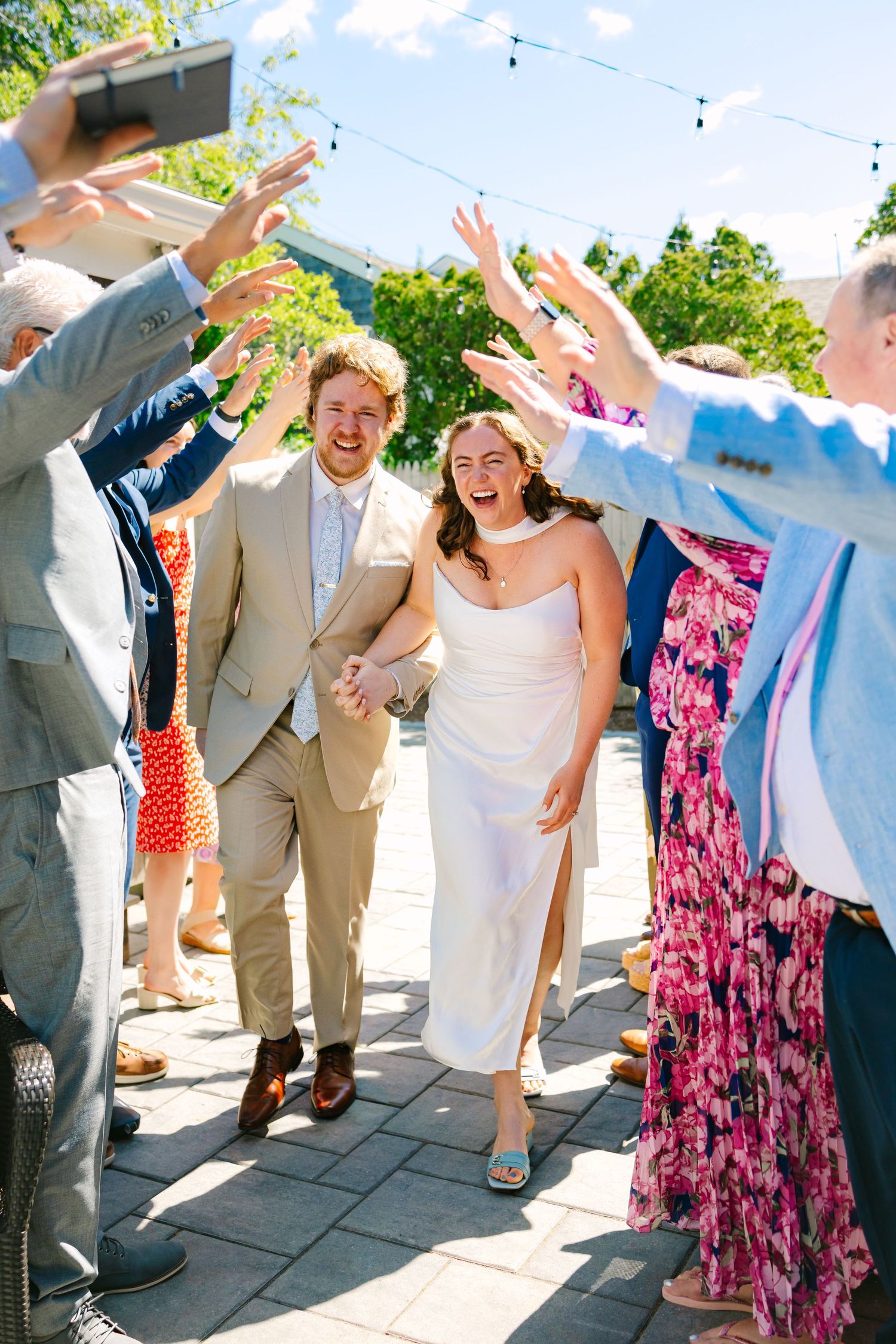 Newlyweds and their family excitedly celebrating after their intimate ceremony at their Harwich Port, Cape Cod Massachusetts elopement