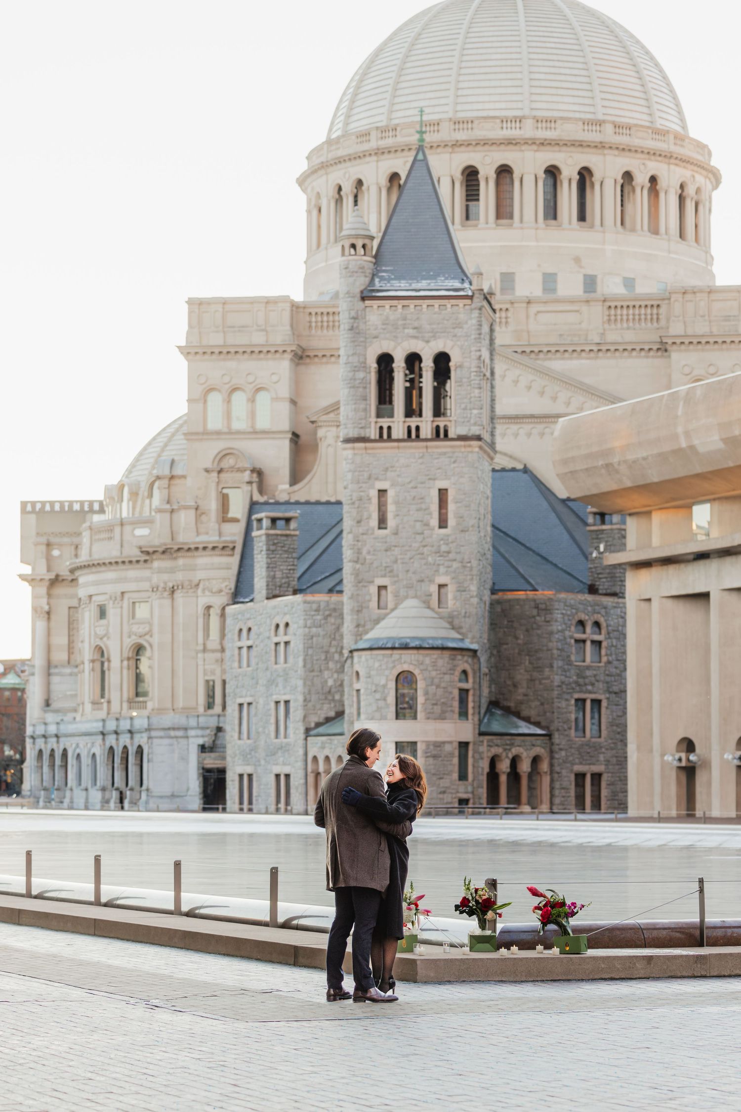 A newly engaged couple during their surprise proposal at Mother Church of Christian Science in Boston Massachusetts