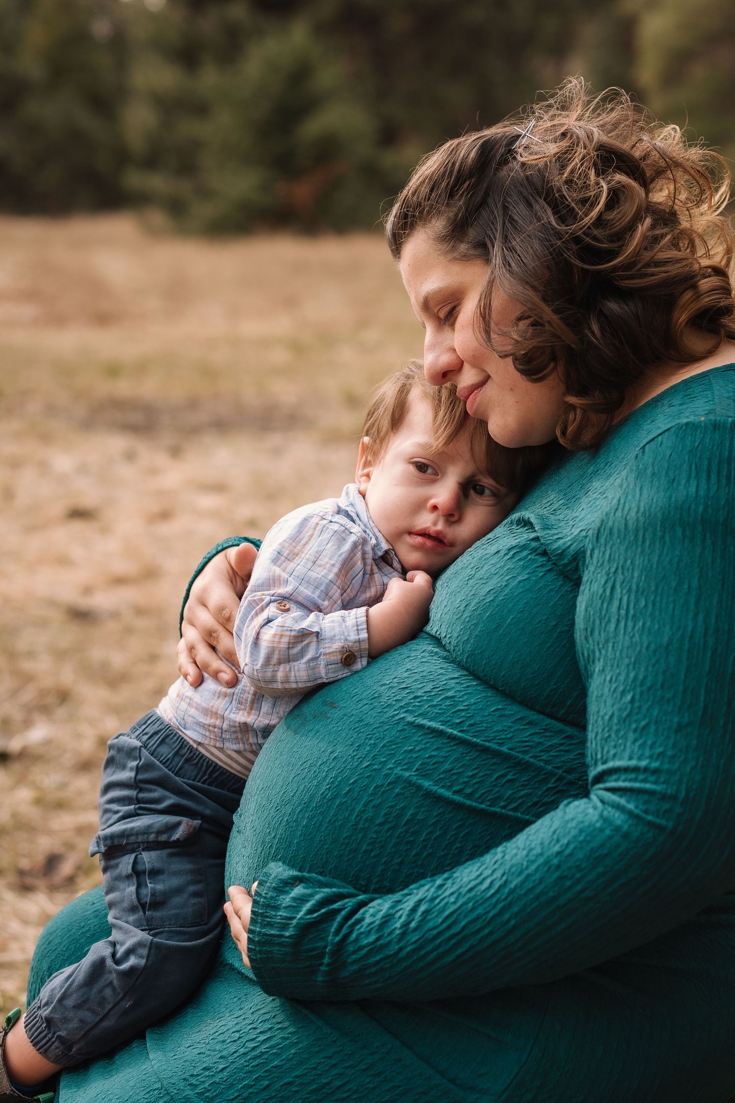 A tender moment shows a small child resting against someone wearing a green sweater in a series of intimate photos.