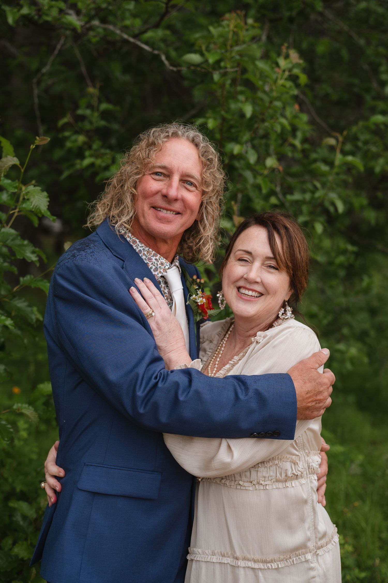 Joyful wedding couple portraits in the lush mountains of Idaho. Wedding photography for Spokane, Washington and Pacific northwest couples.