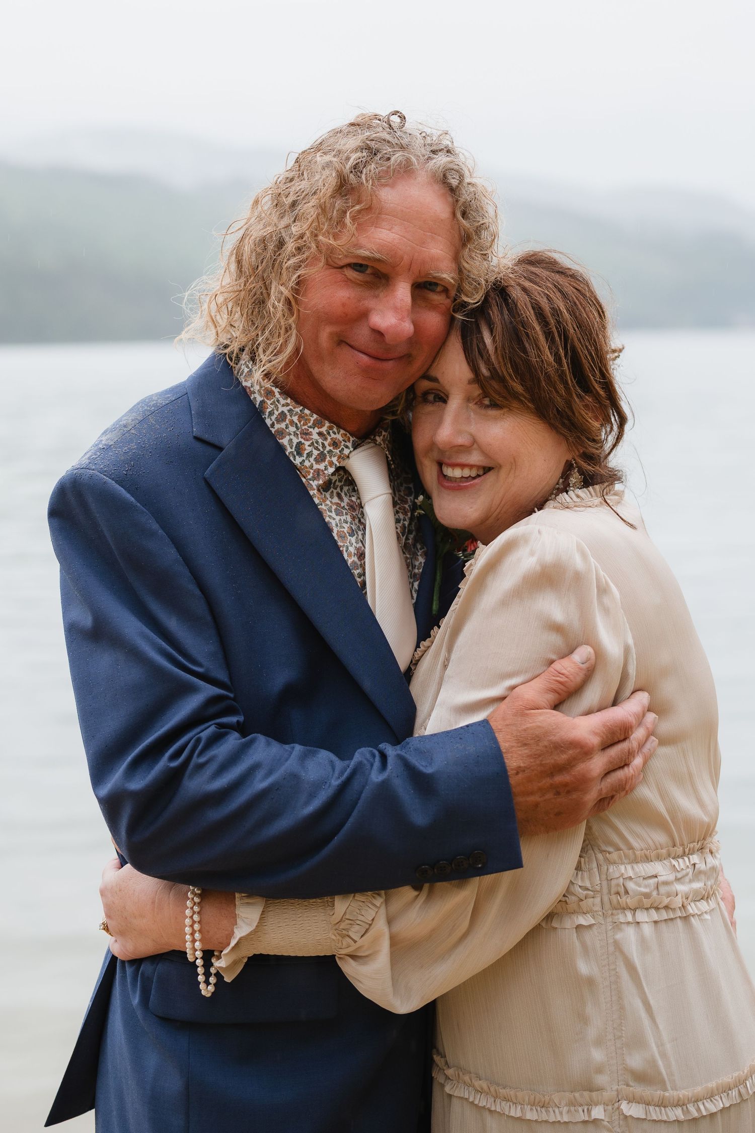 A romantic beach photo sequence of a couple embracing while wearing formal attire near the ocean.