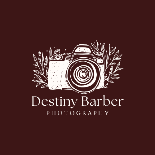 White camera logo design with floral elements on brown background for Destiny Barber Photography.
