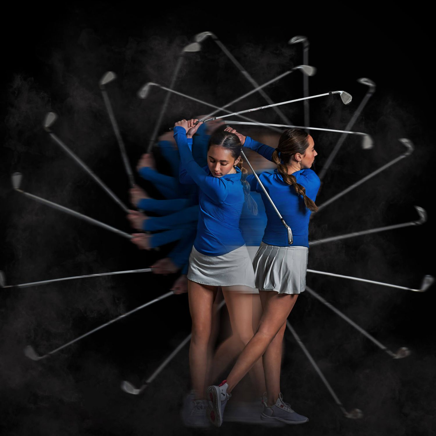 Two female golfers in blue shirts captured in a multi-exposure composite showing their full golf swing sequence against dark background.