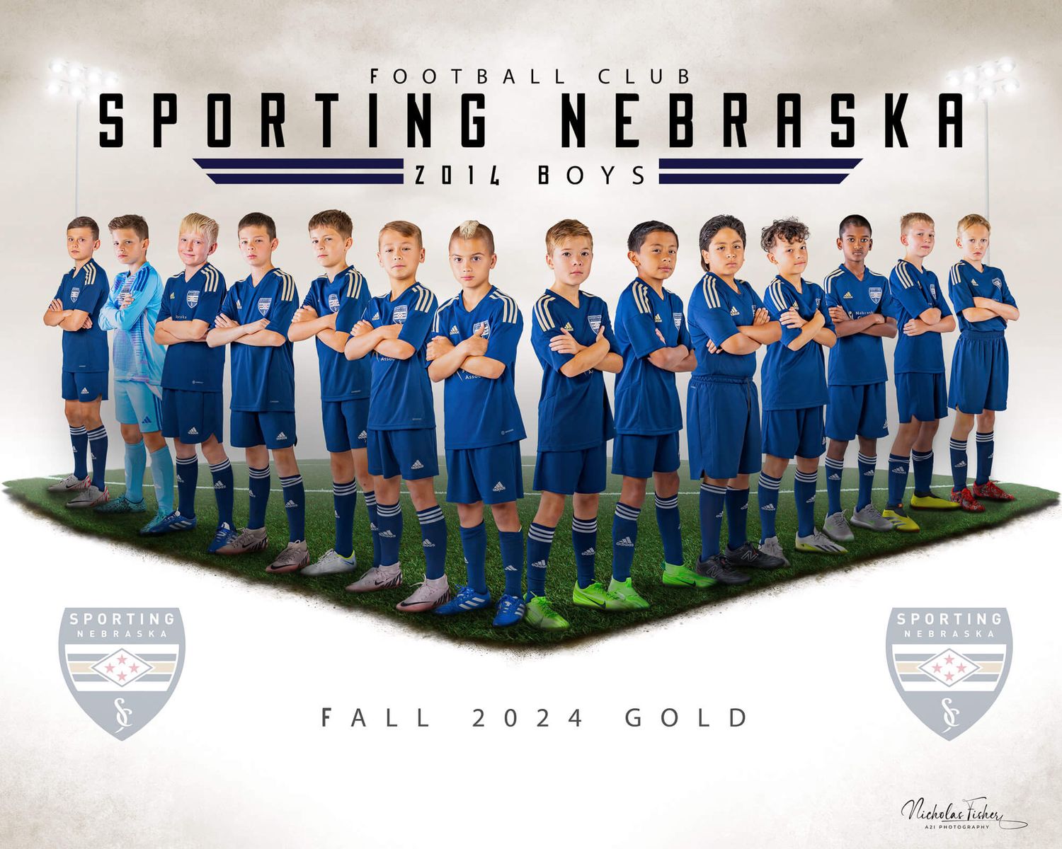 A panoramic team photo of a boys soccer club wearing blue jerseys lined up in rows against a white background.