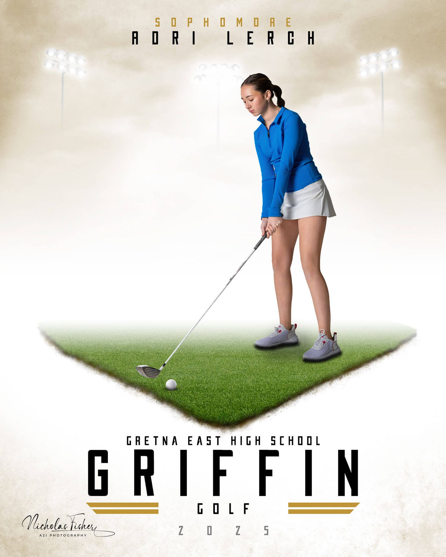 A golfer in blue shirt and white shorts practices their swing stance on a green artificial turf surface.