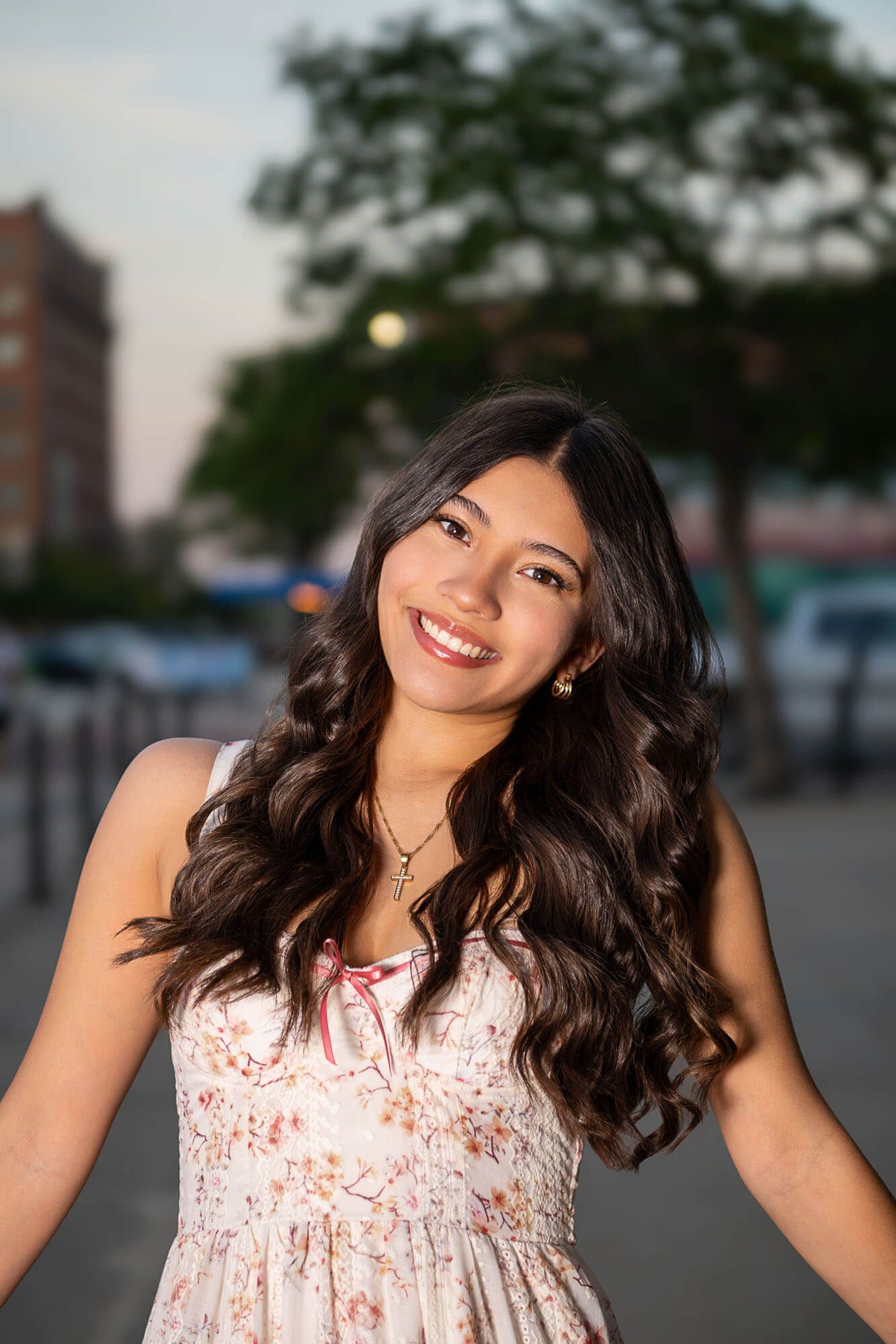 A series of outdoor portrait shots showing someone in a floral dress posing with dynamic expressions.