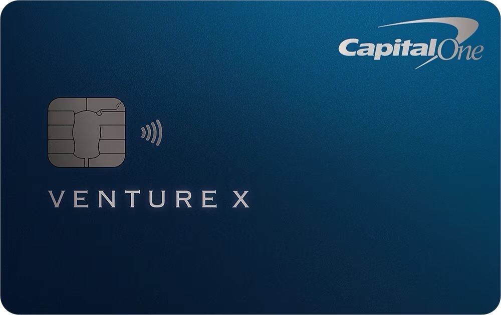 Capital One Venture X credit card in deep navy blue with minimal design elements.