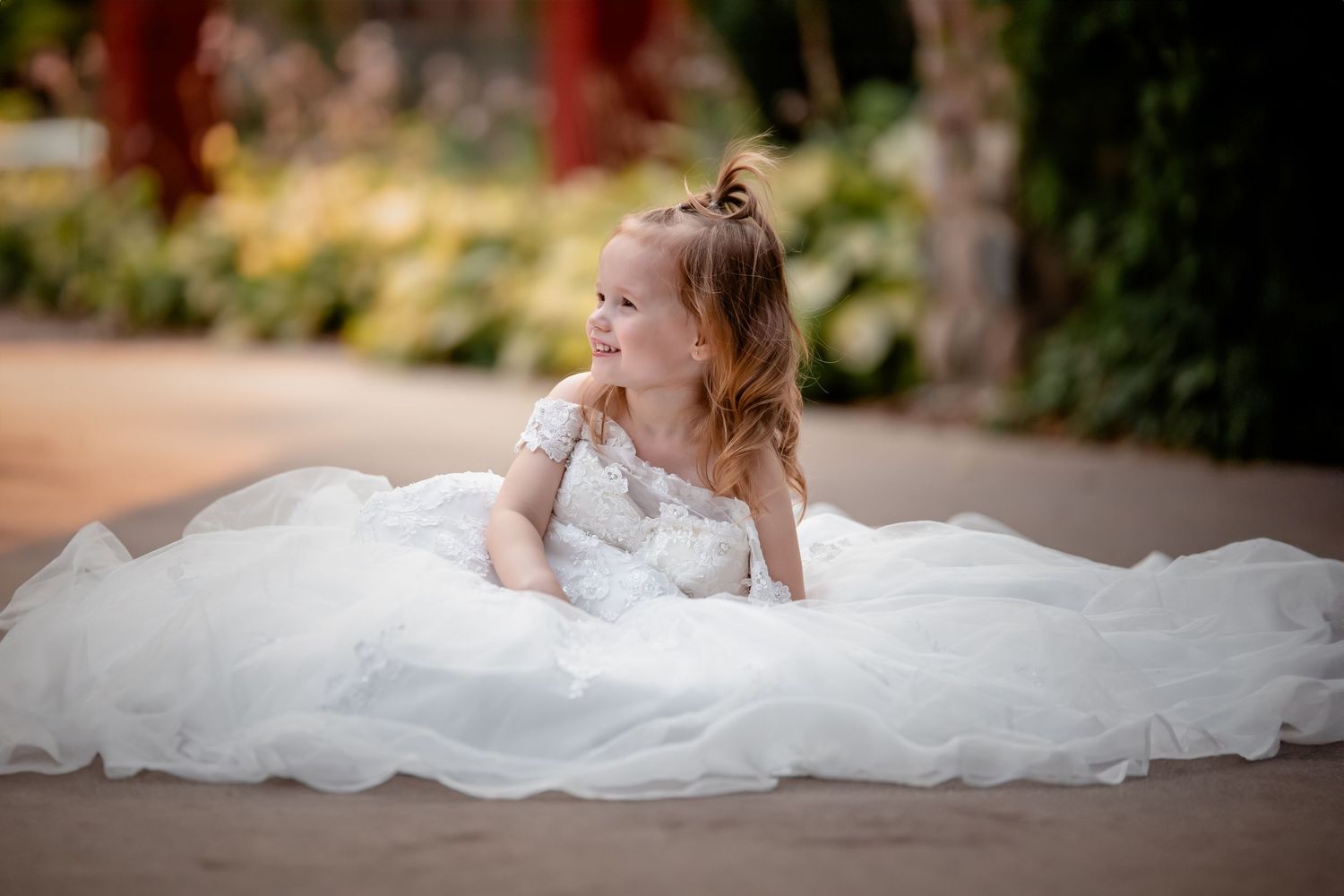 A series of bridal portraits showing a bride in a flowing white dress posing gracefully in different positions.