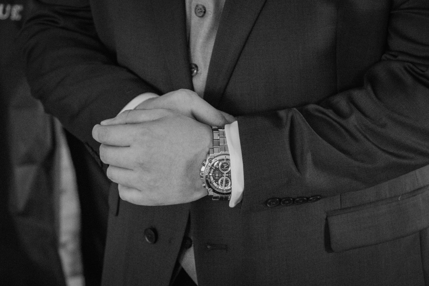 Close up black and white photo of groom. Sioux Falls, SD Wedding Photographer - Meadow Barn at Country Orchards
