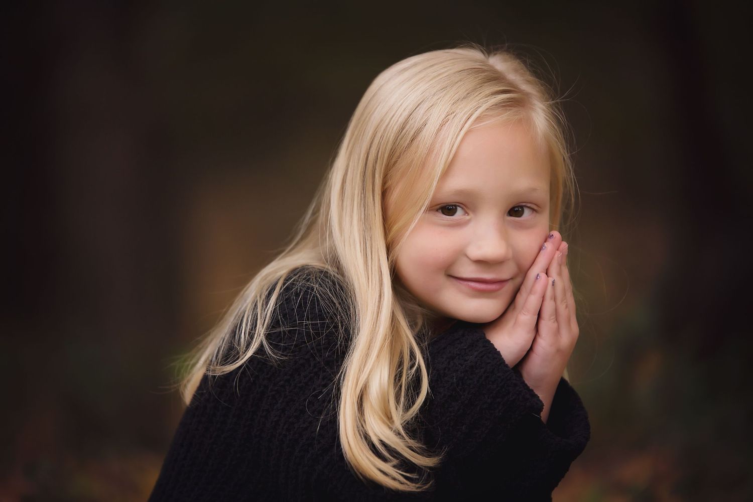 A series of six candid portrait photos showing a young child with blonde hair expressing different emotions and poses.