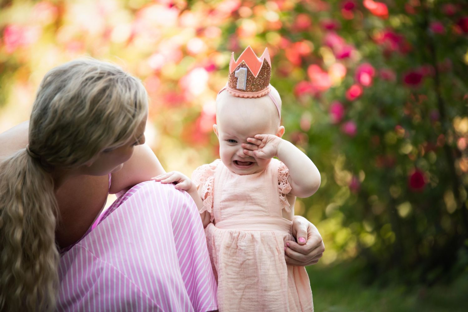 Sweet outdoor photography captures gentle moments amid blooming garden scenery.