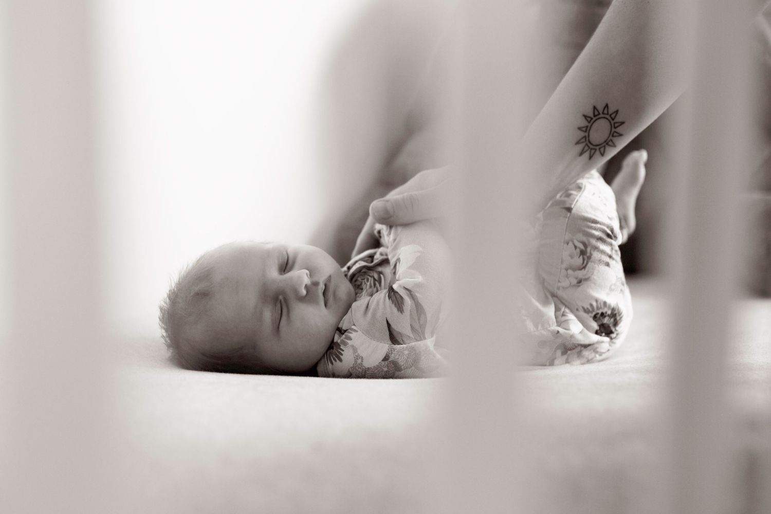 Artistic black and white close-up photo showing soft feminine curves and shadows.